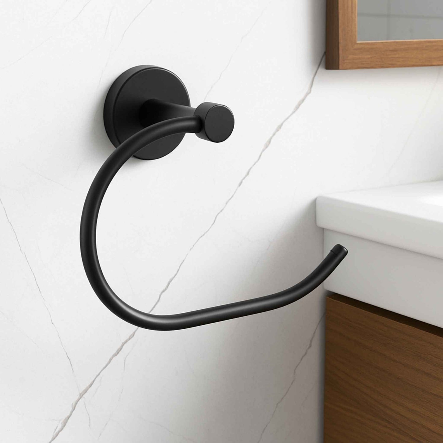 Black towel hook mounted on a white tiled wall with wooden cabinet. 24 inch gold wall-mounted towel bar in premium brass finish for luxury bathroom décor