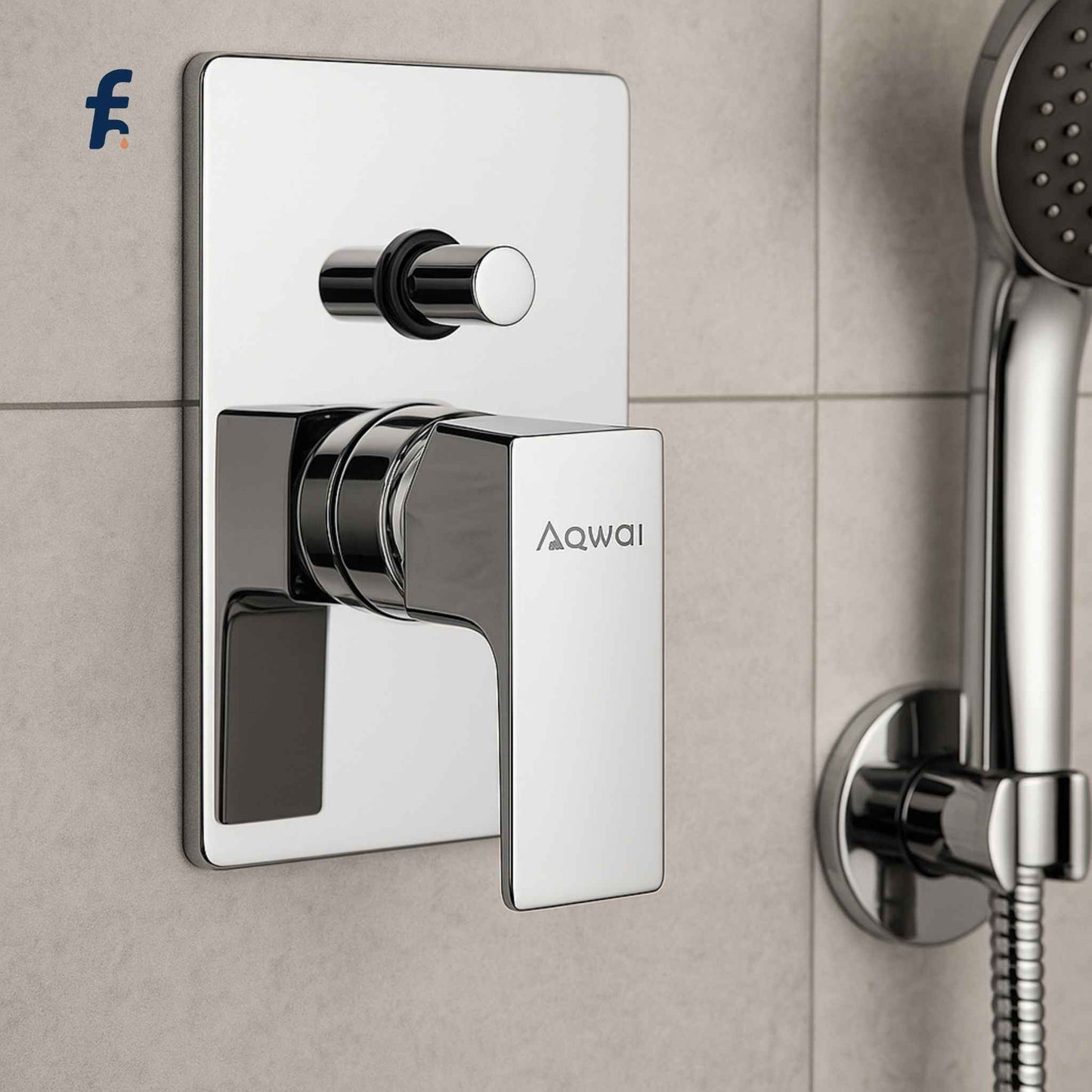 Chrome shower valve and handheld shower head on a tiled wall with Aqwai branding. Aqwai concealed diverter installed with modern shower setup