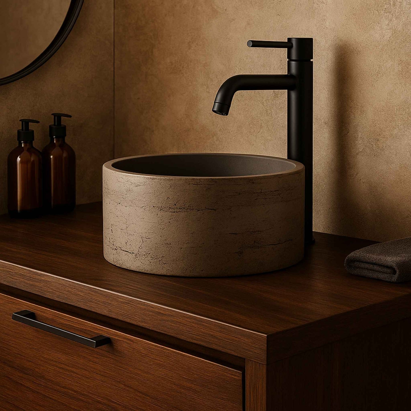 Bathroom sink with black faucet on a wooden vanity against a beige wall.