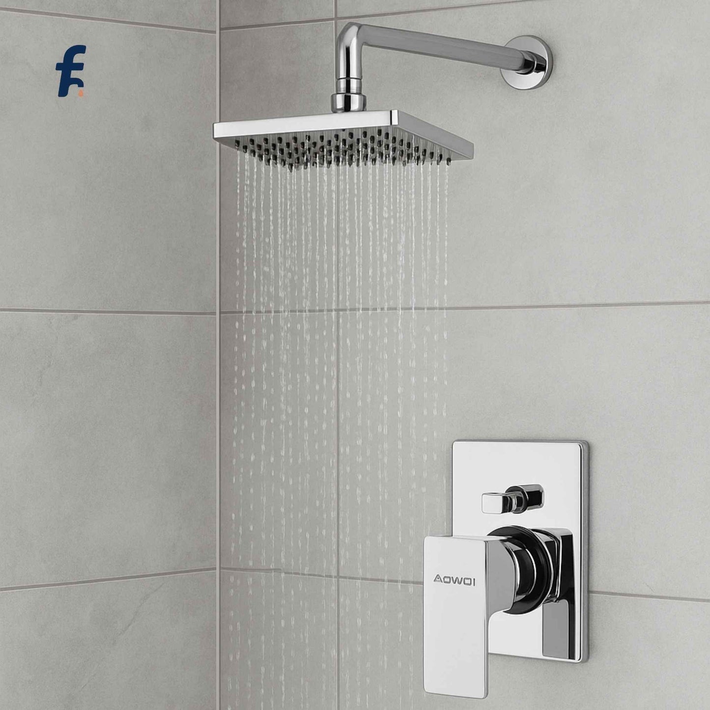 Chrome shower head and control panel on a tiled bathroom wall Single lever chrome diverter close-up view
