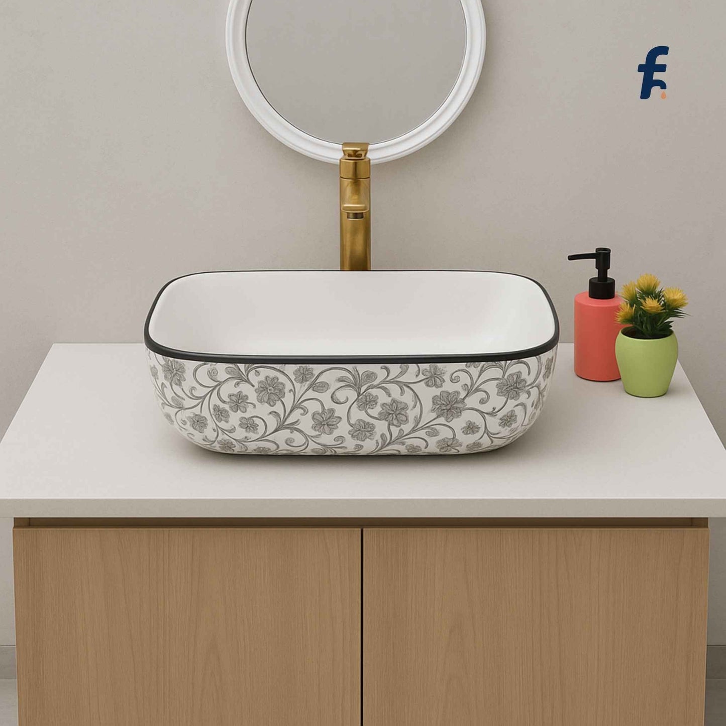 Decorative bathroom sink with floral pattern on a wooden vanity unit.