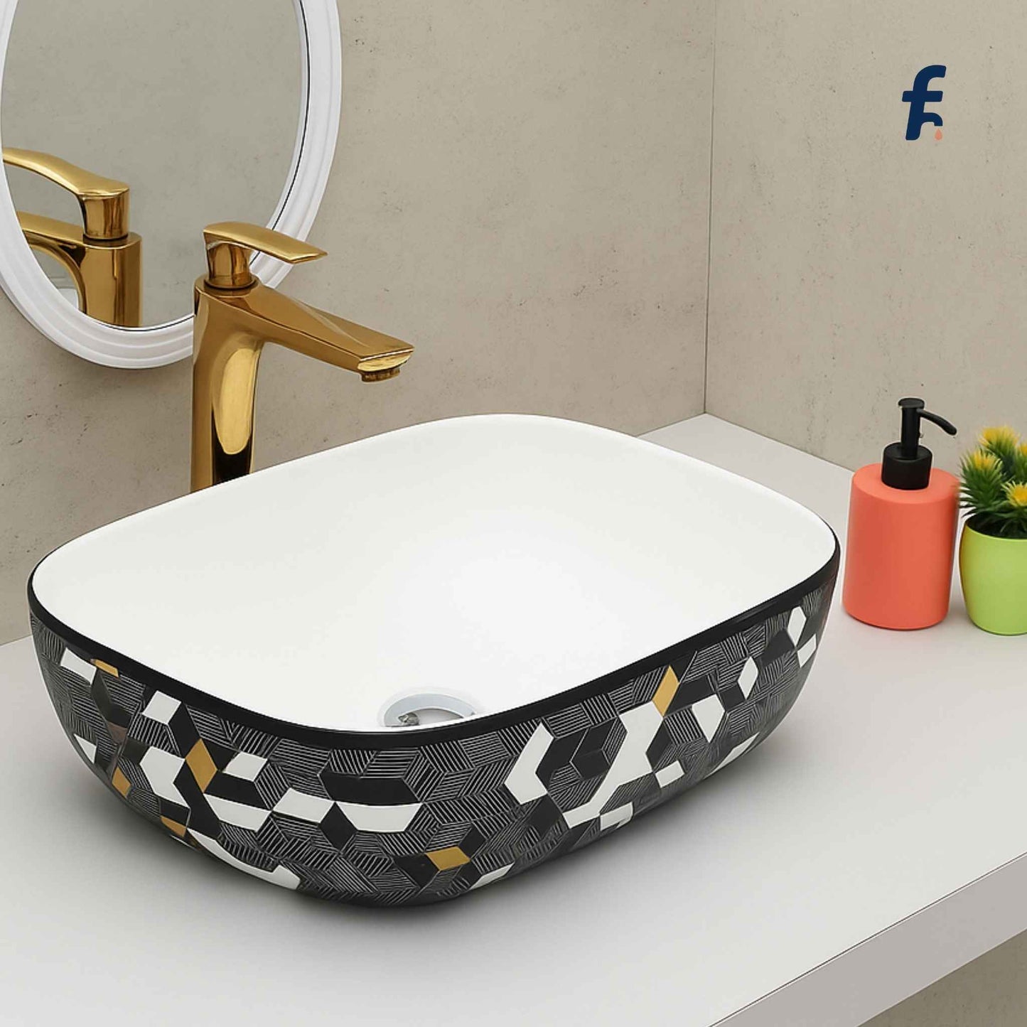 Bathroom vanity with a geometric-patterned sink, gold faucet, and decorative items.