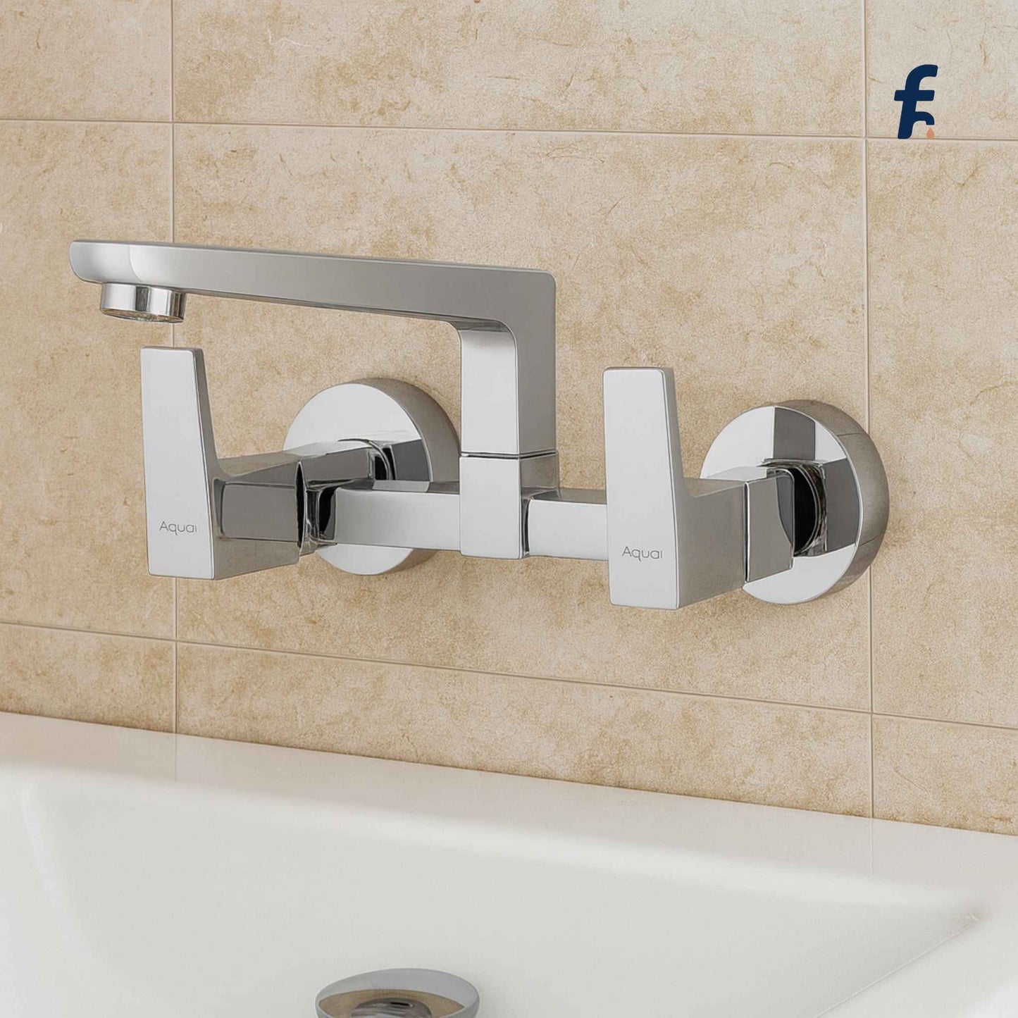 Chrome wall-mounted faucet on a tiled bathroom wall