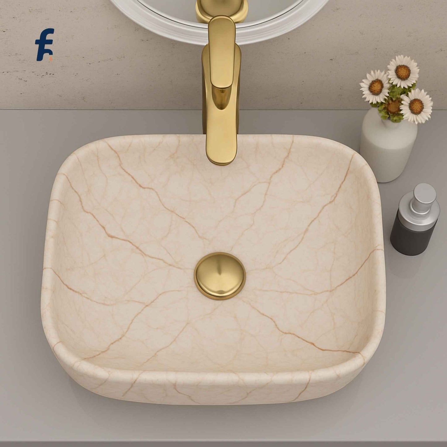 Beige ceramic sink with gold faucet on a bathroom counter, Top view of 18x13 cream marble table top wash basin – budget bathroom sink