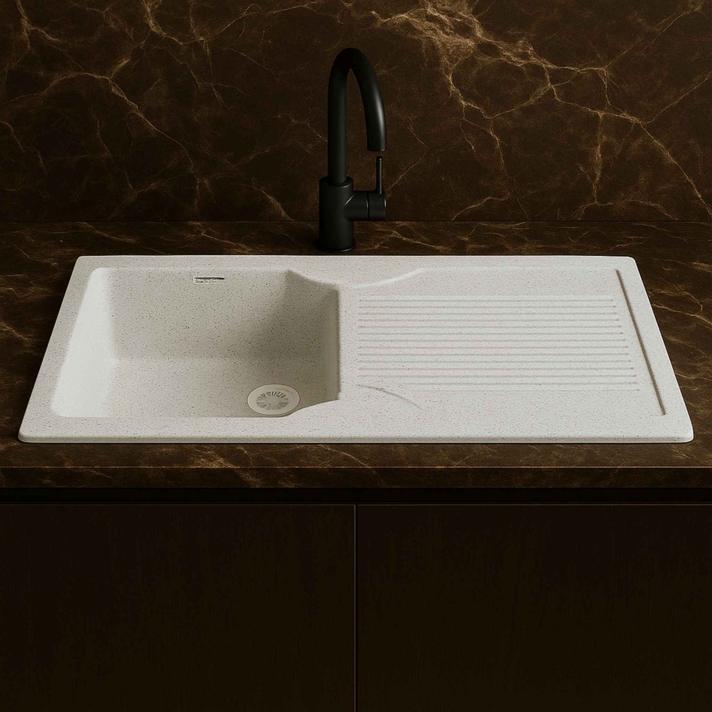 Front view of Alaska white speckled granite kitchen sink with drainboard and premium faucet in satvario marble countertop