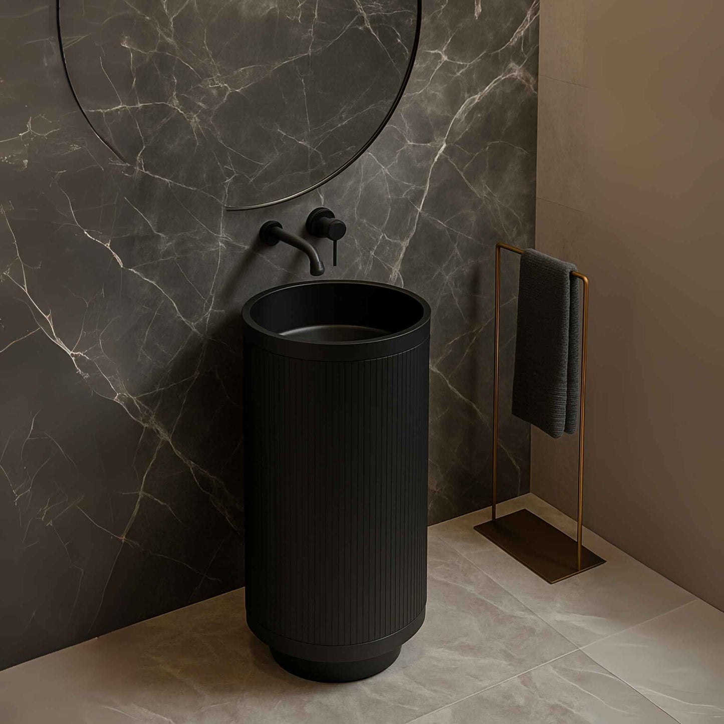 Side view of black pedestal basin with wall-mounted faucet