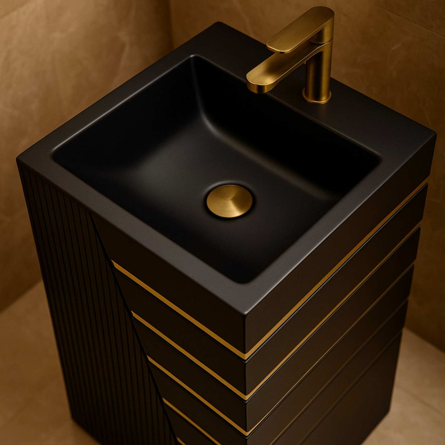 Top view of black pedestal basin with square sink and gold faucet