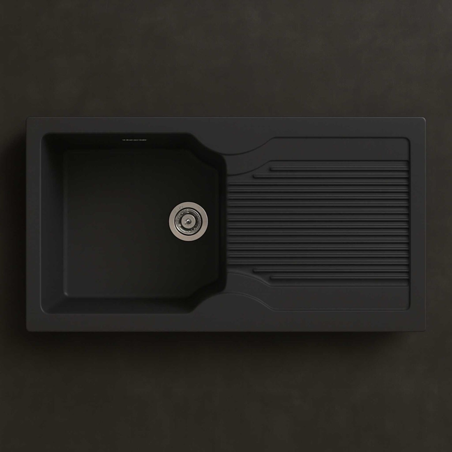 Top view of 36x18x9 inch black quartz kitchen sink with drainboard