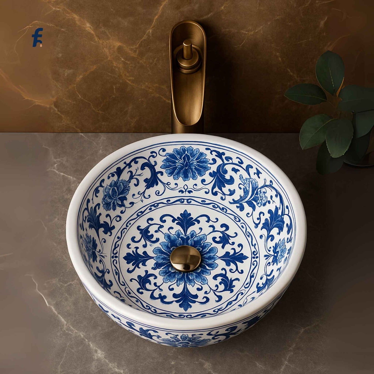 Ceramic sink with blue floral patterns on a marble countertop
