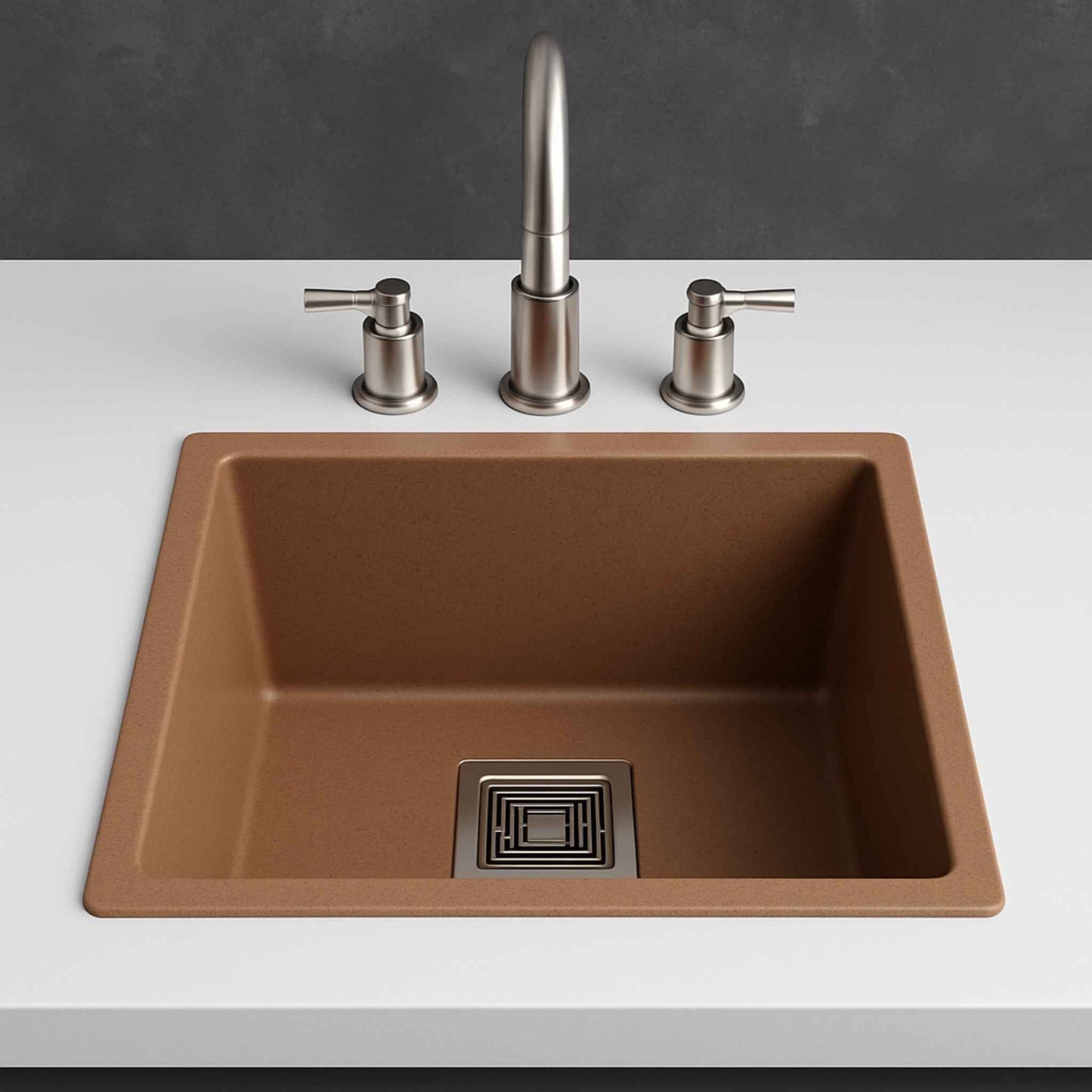 Front angle of brown granite kitchen sink with modern stainless steel faucet in a luxury kitchen