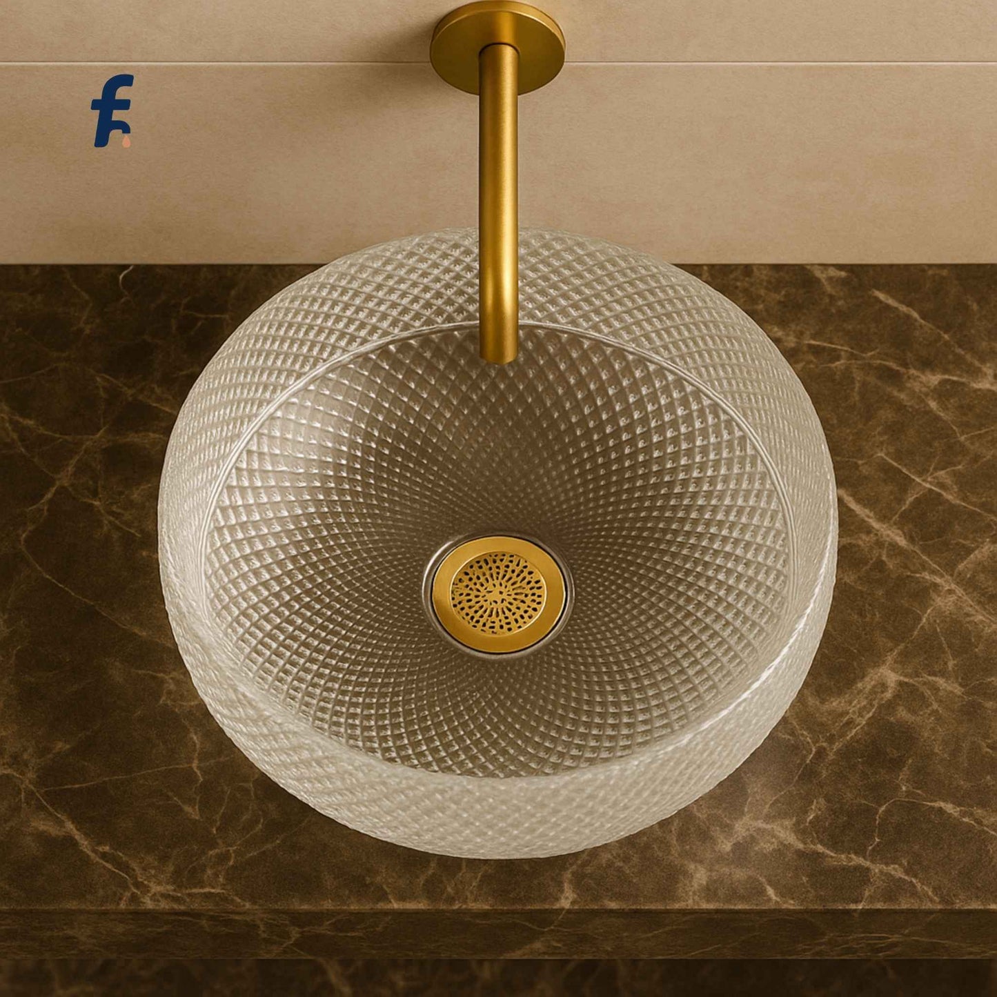 Top view of round clear glass bathroom sink with gold faucet