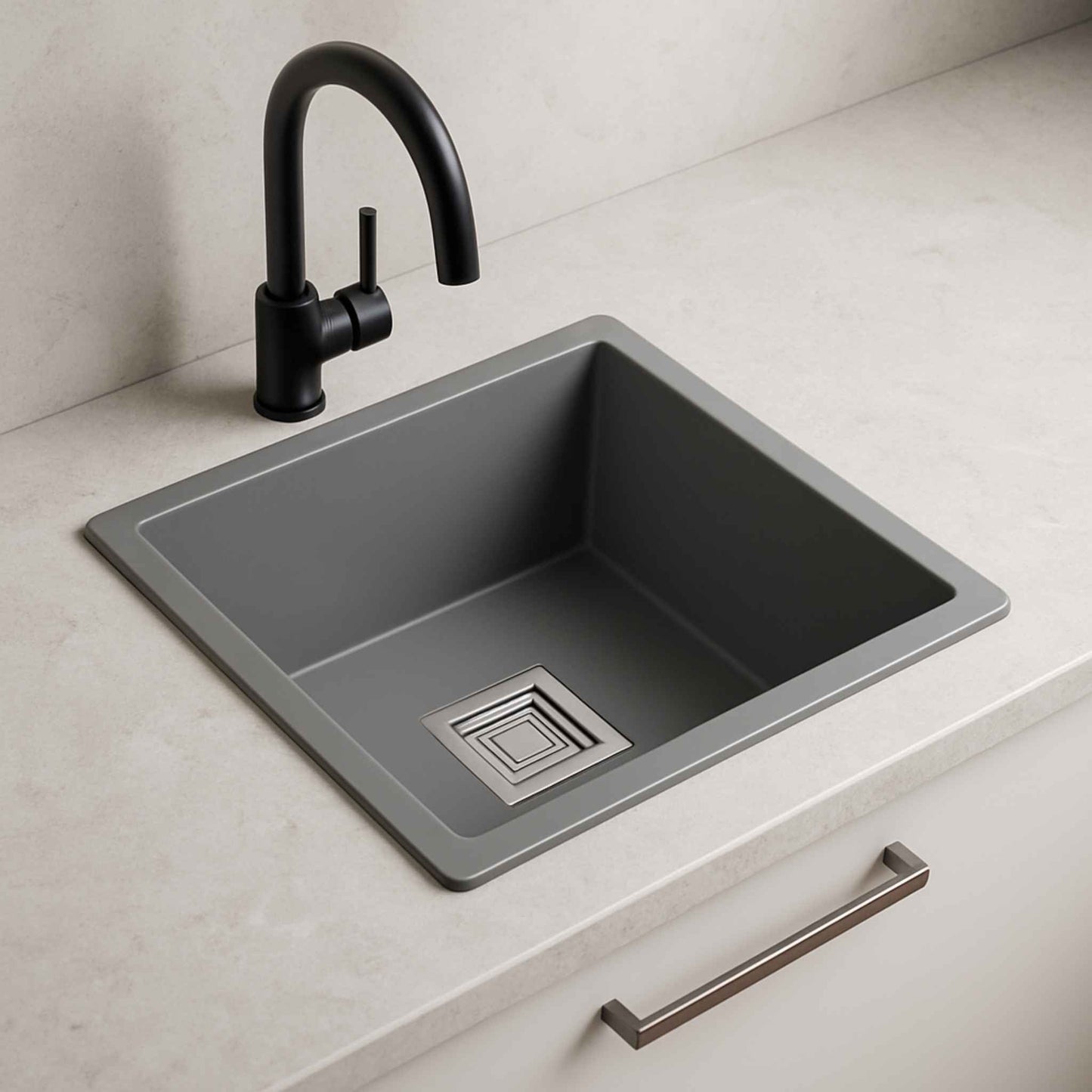 Side profile of matte grey metallic sink with compact depth