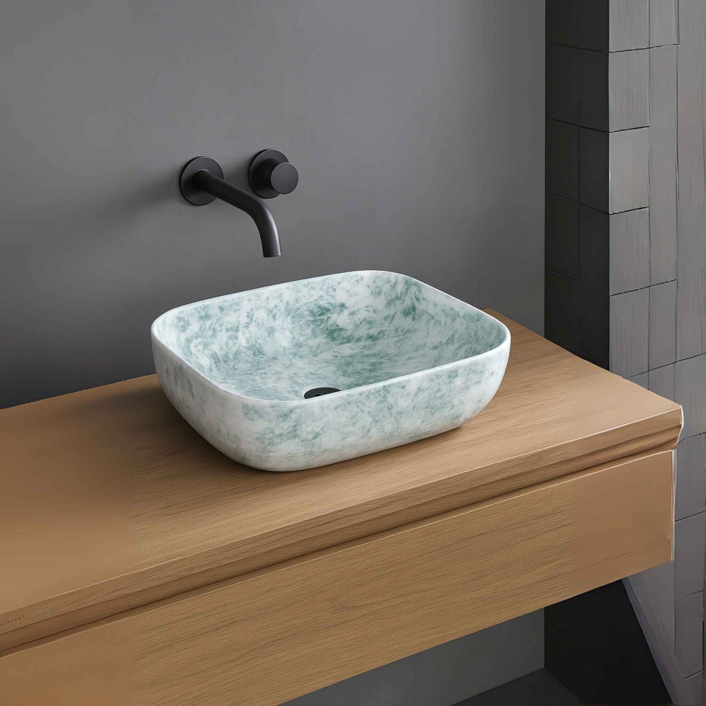 Side profile of modern ceramic wash basin in marble finish with wall-mounted faucet