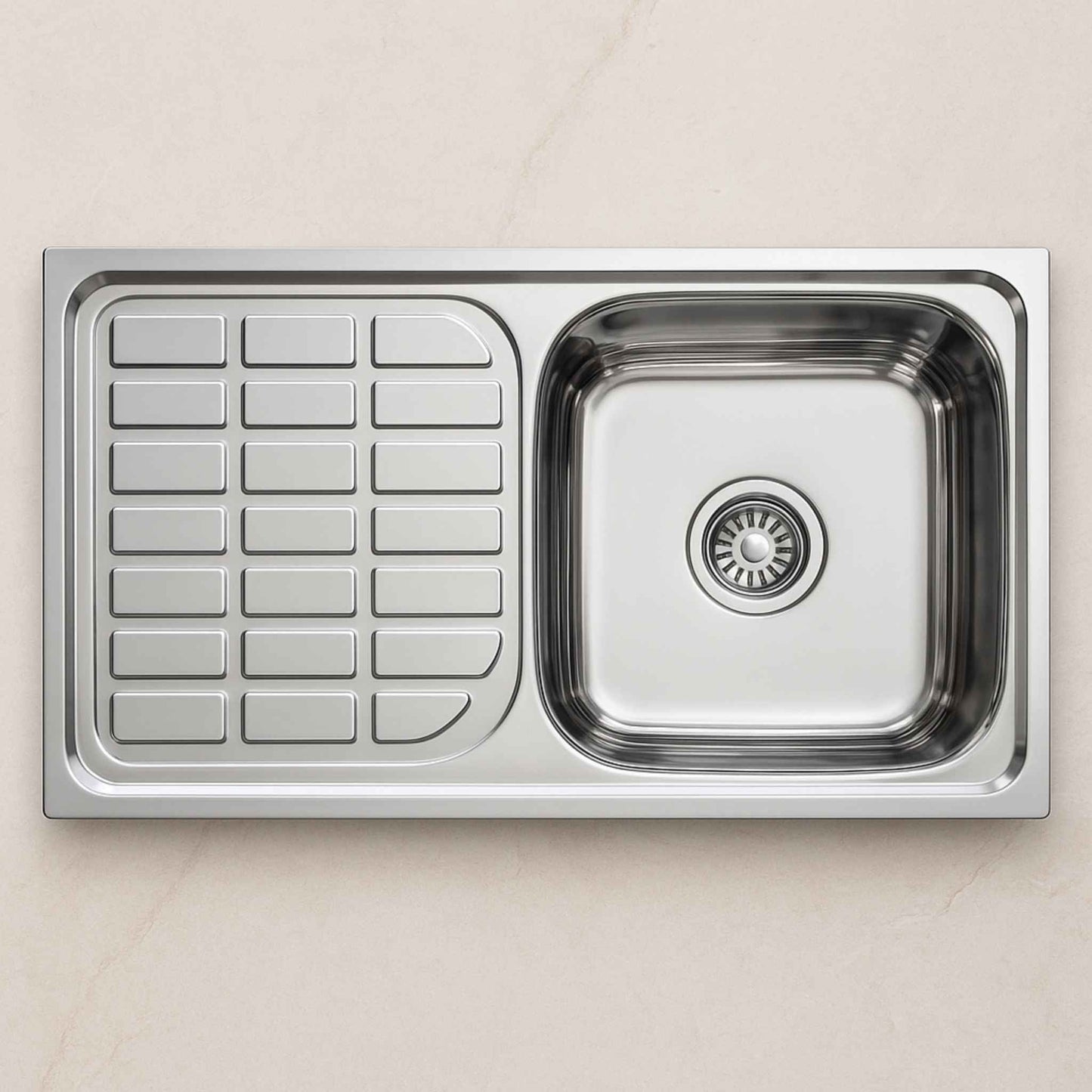 Top view of stainless steel kitchen sink with drainboard