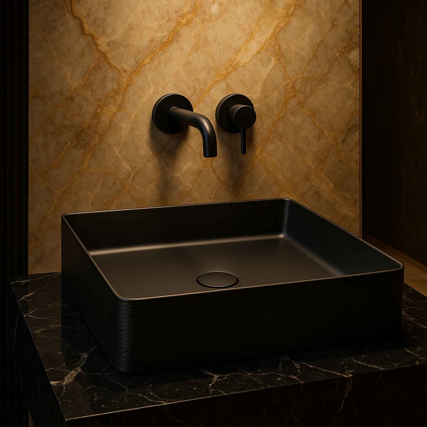 Black rectangular sink with wall-mounted faucet against a marble wall.