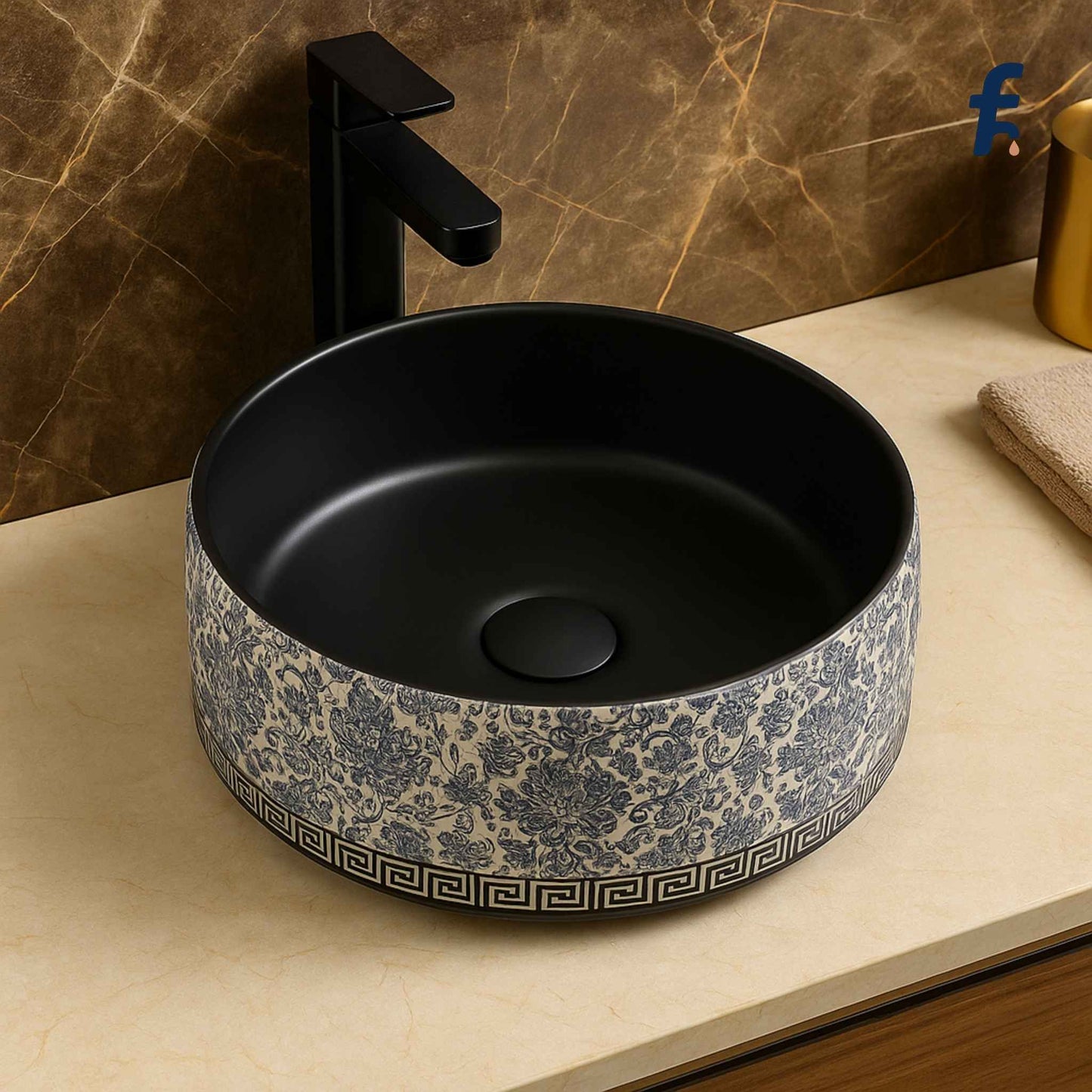 Top view of round floral ceramic wash basin with deep matte black bowl and decorative edge
