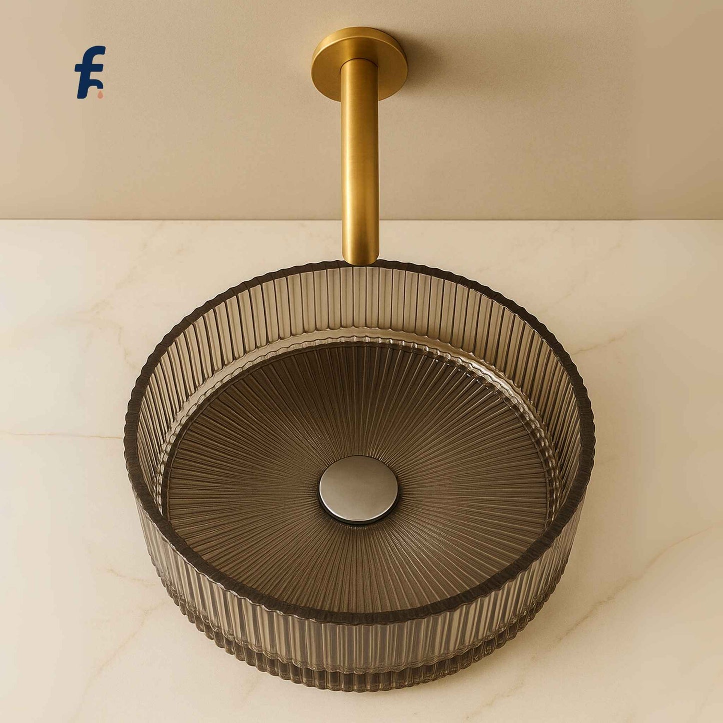 Top angle view of round fluted glass wash basin in luxury setting