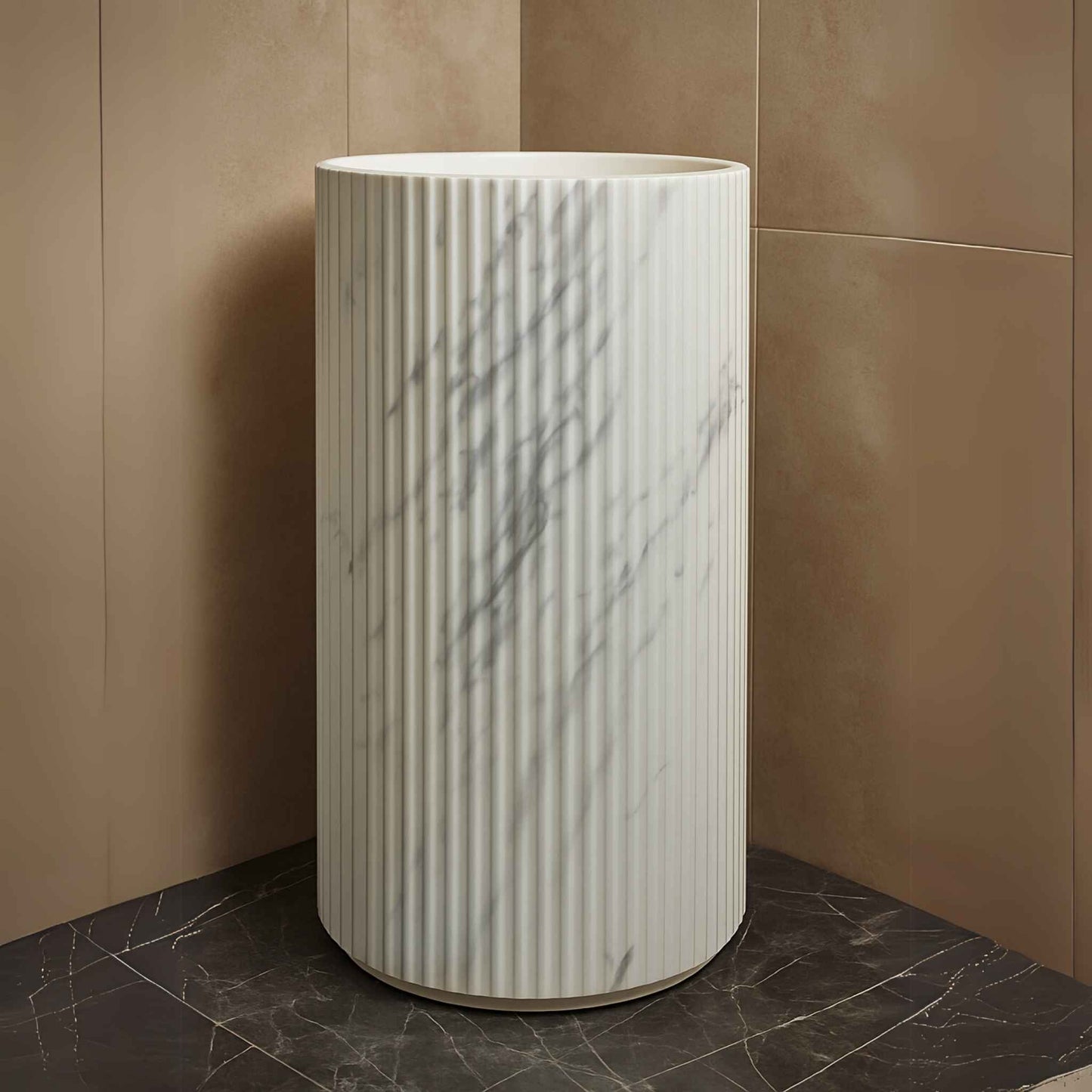 Front view of white marble fluted pedestal sink with floor-mounted tap
