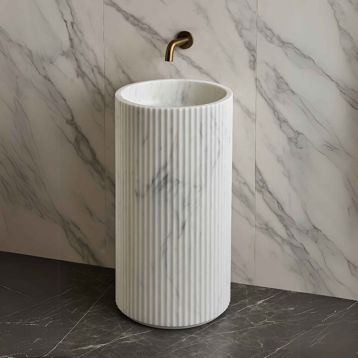 Front view of white marble fluted pedestal sink with floor-mounted tap