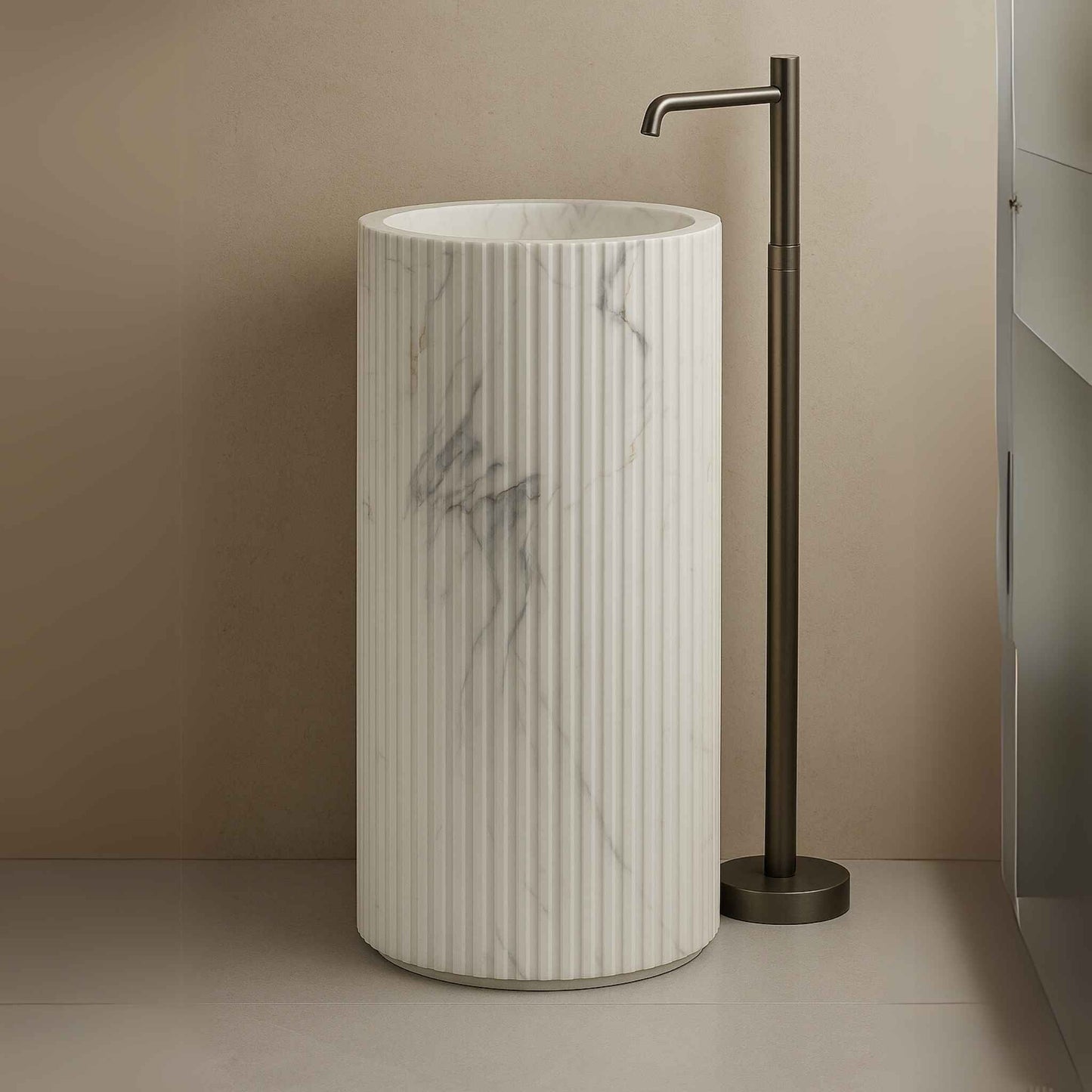 Side view of cylindrical fluted washbasin with marble veining against tiled background