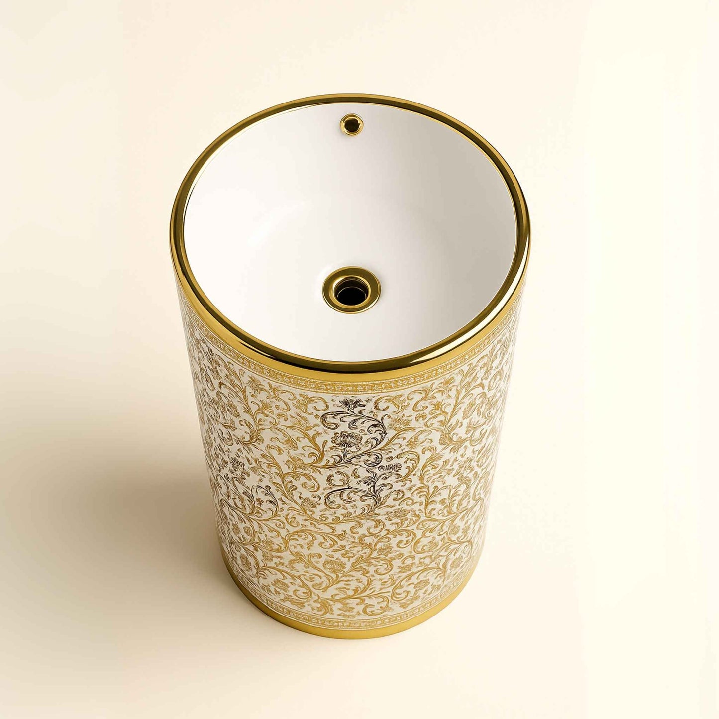 Top angle of ornate floral washbasin with glossy gold rim