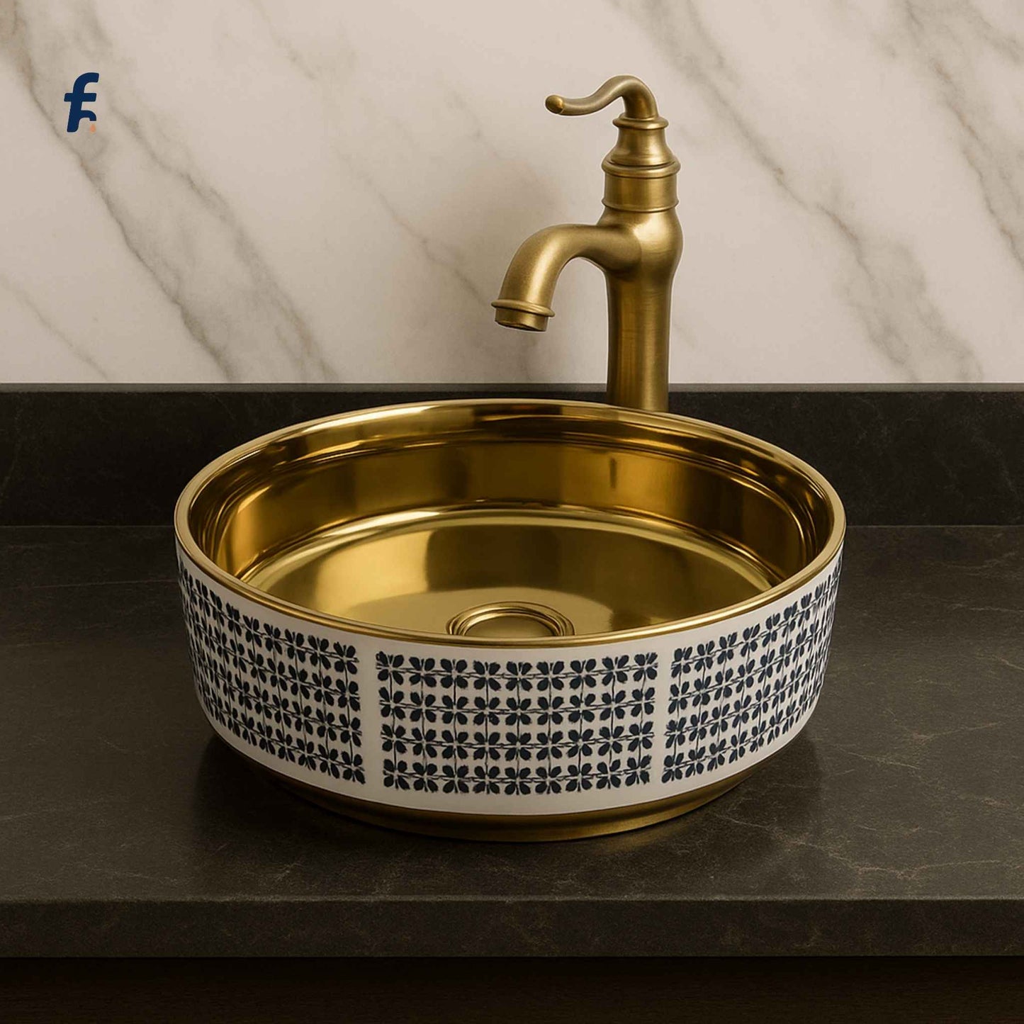 Gold sink with decorative pattern on a marble background