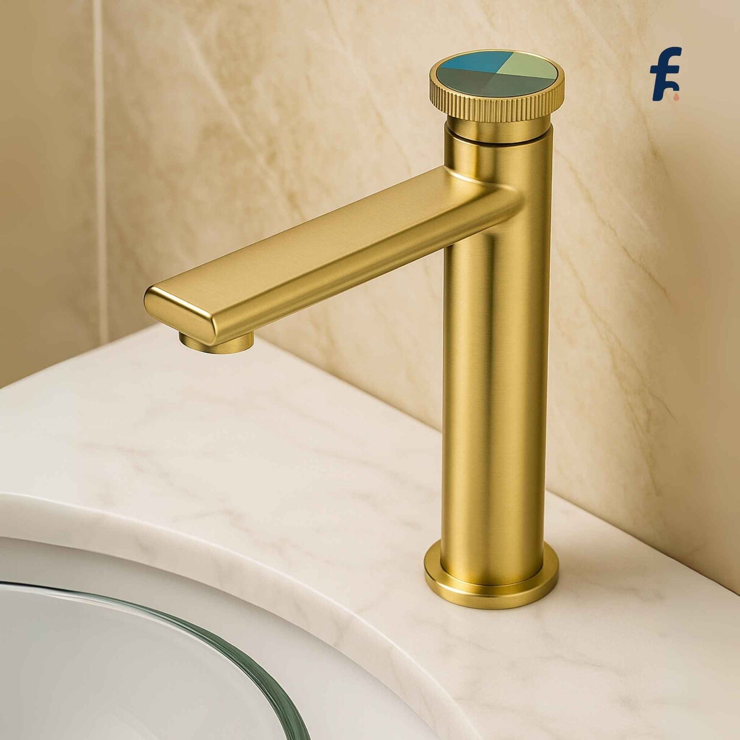 Gold faucet on a bathroom sink with a beige wall background