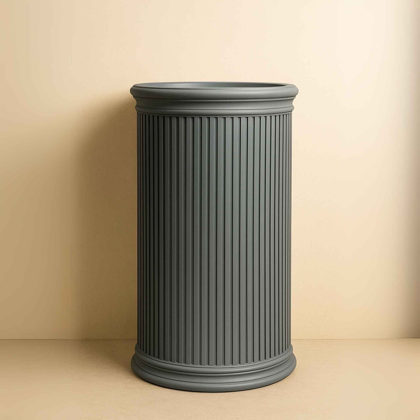 Front view of grey round fluted pedestal basin