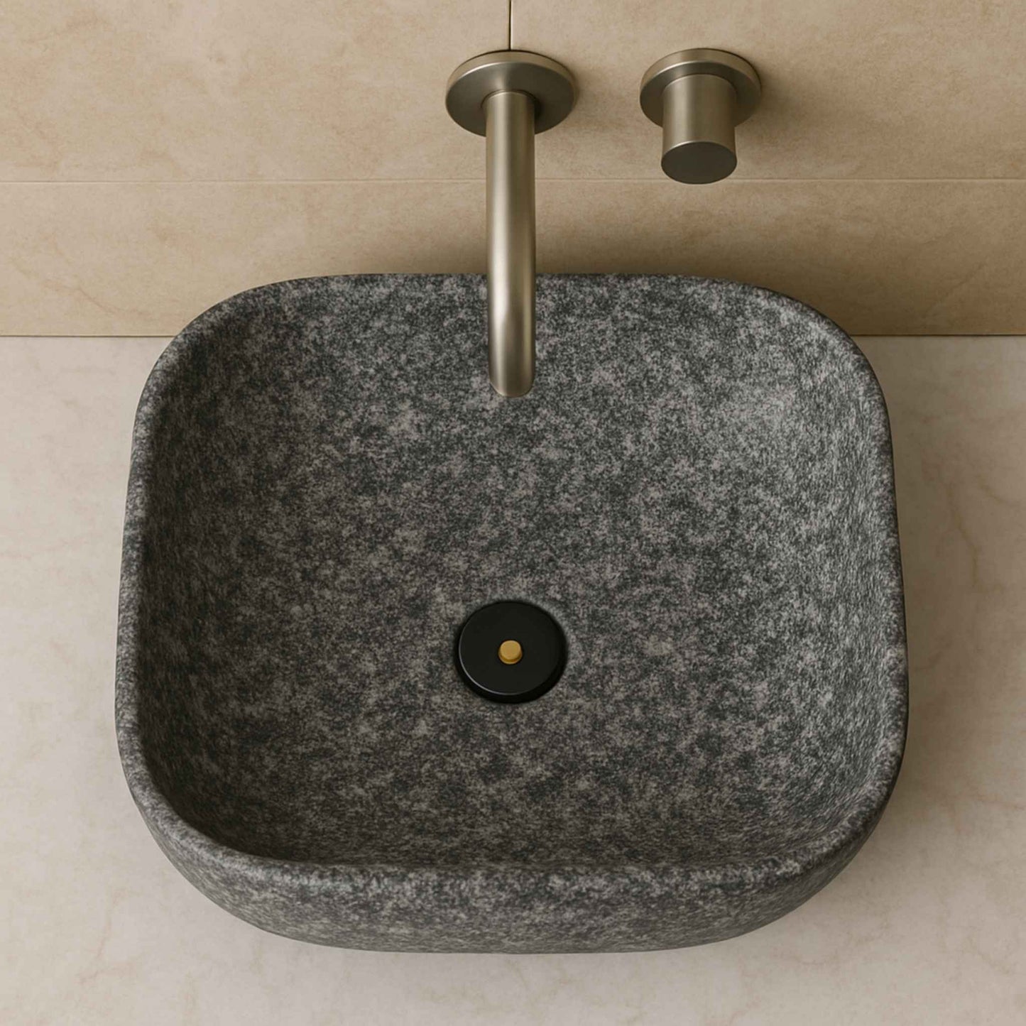 Top view of rectangular granite wash basin with brushed steel wall faucet