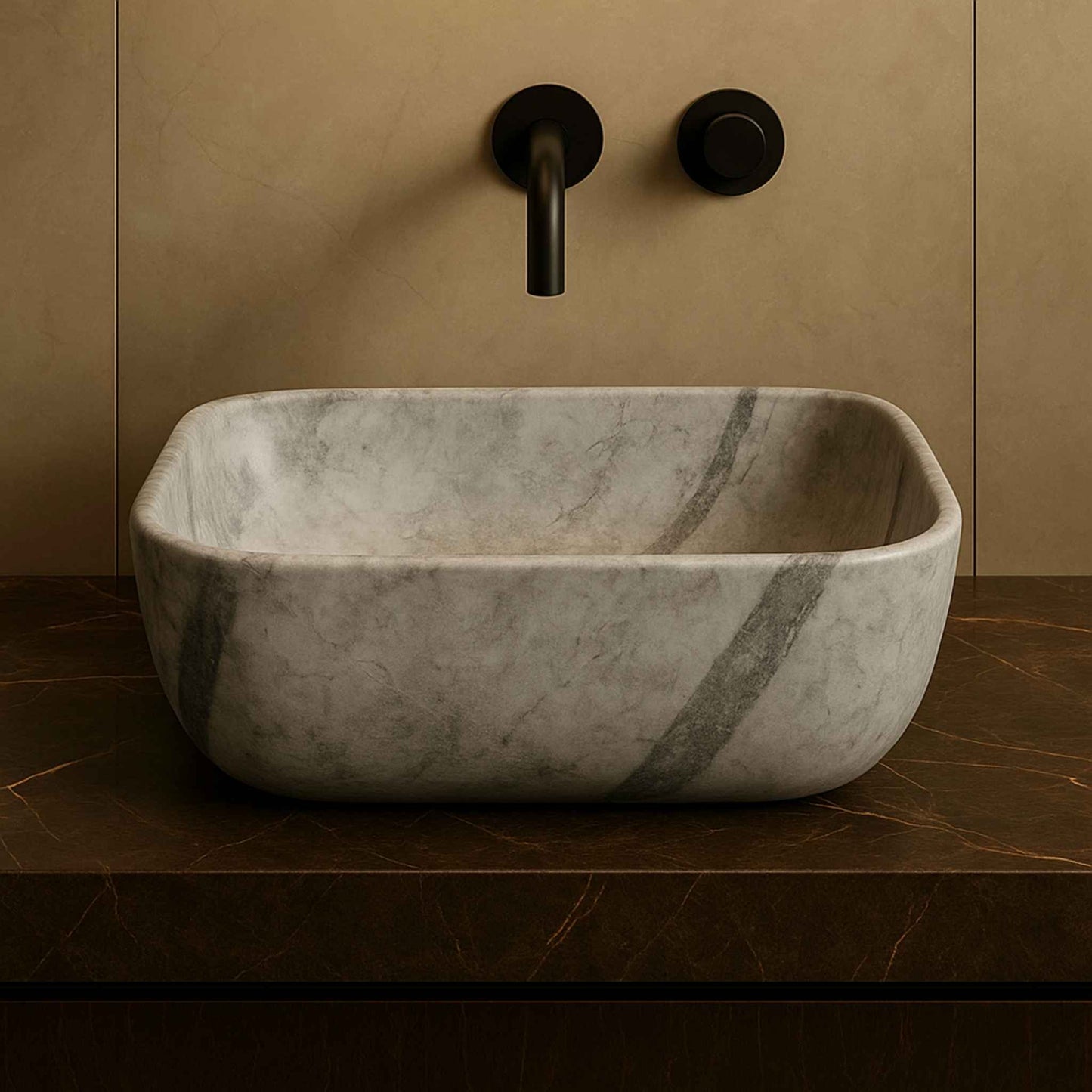 Front angle of a grey marble countertop wash basin with natural veining and matte black faucet, placed on a dark brown vanity in a luxury bathroom.
