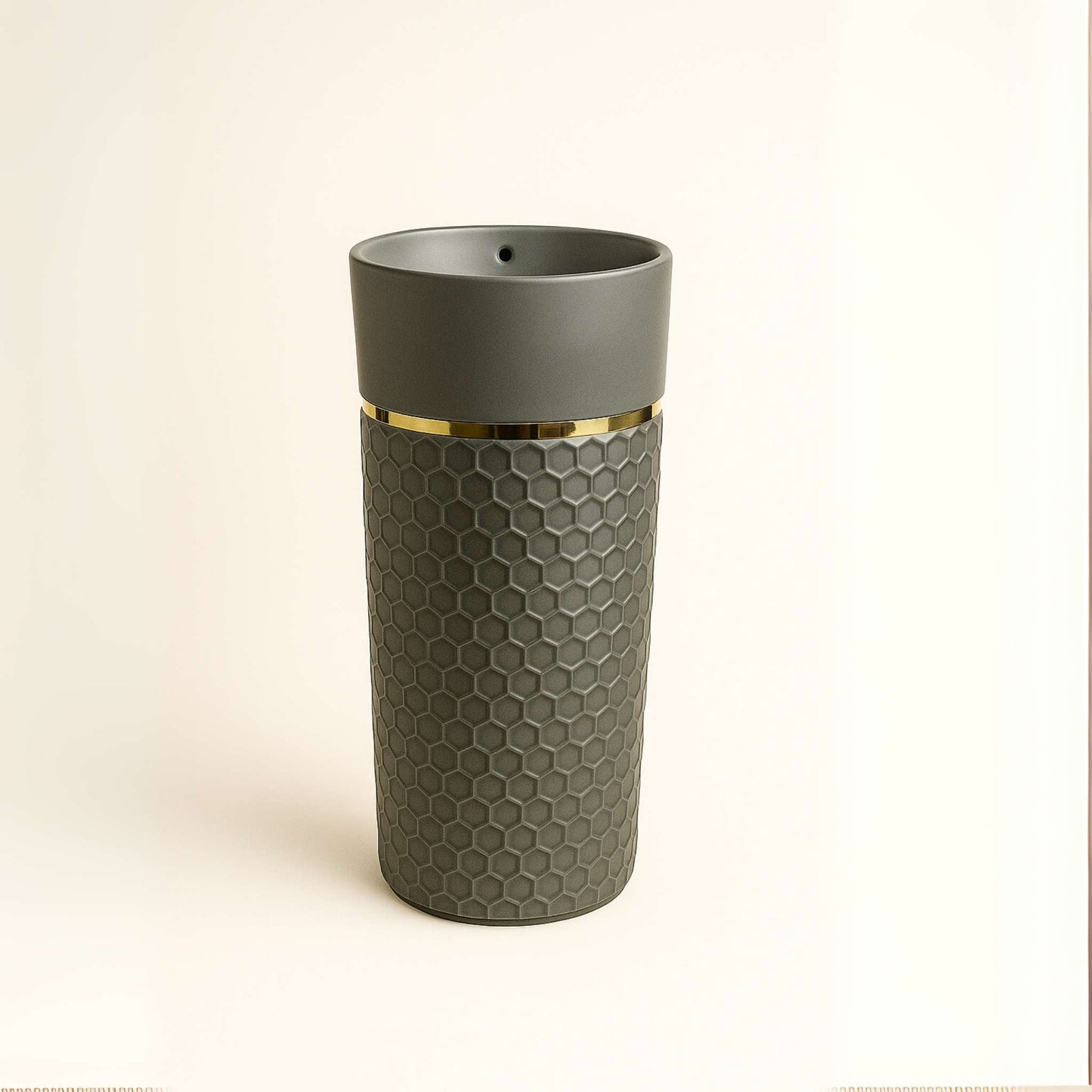 Front view of gray honeycomb pedestal washbasin with gold rim