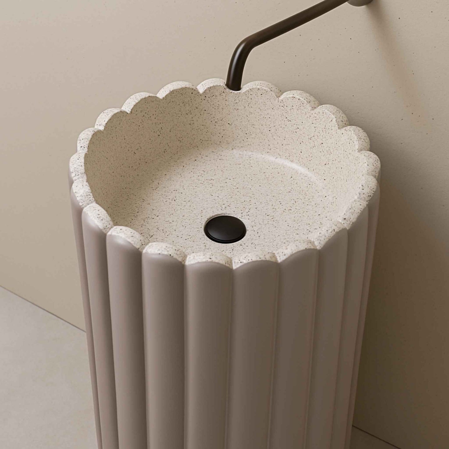 Top angle of scalloped lilac pedestal basin with overhead faucet