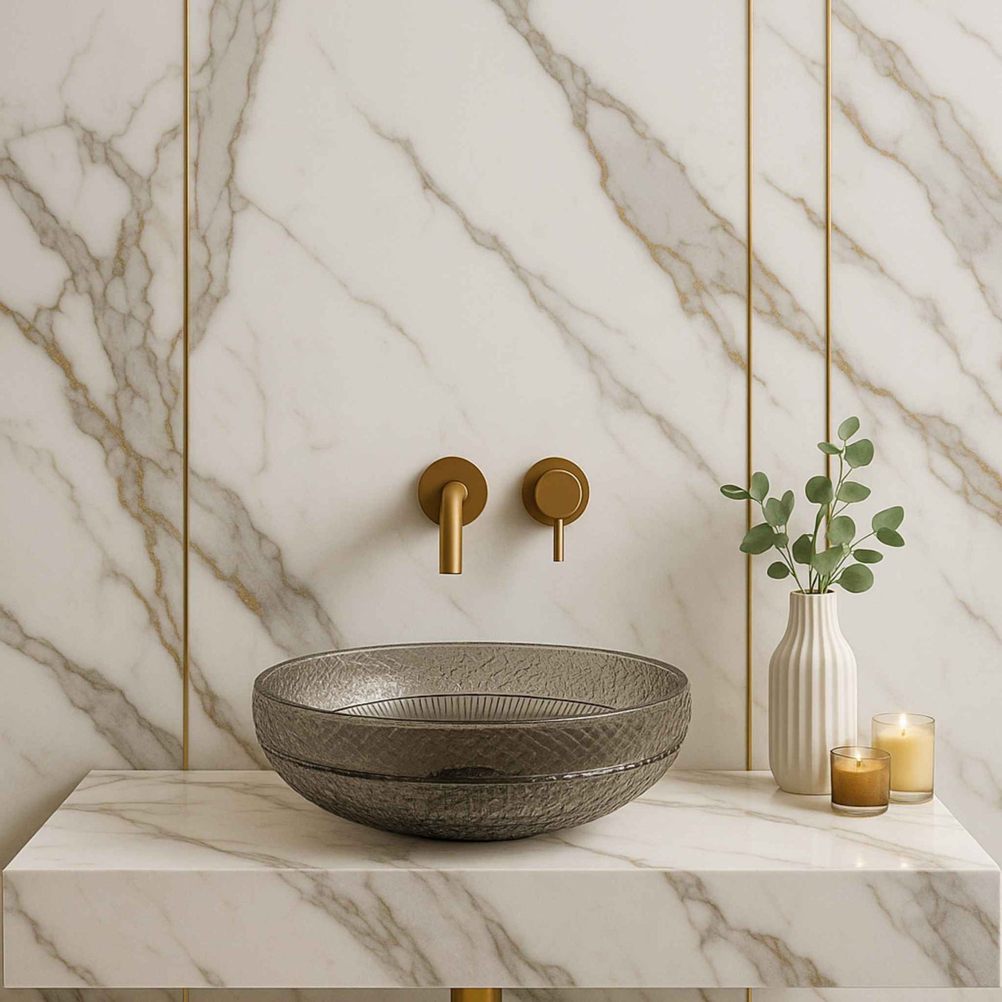 Bathroom setup with a textured sink, gold faucet, and decorative elements against a marble wall.
