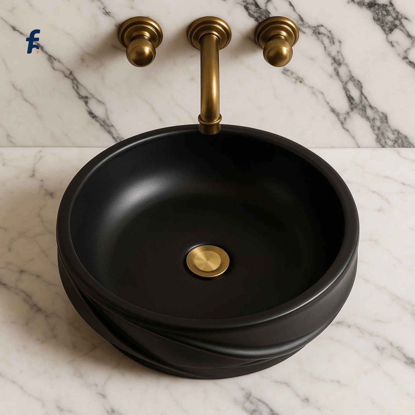 Black round sink with gold faucet on a marble background