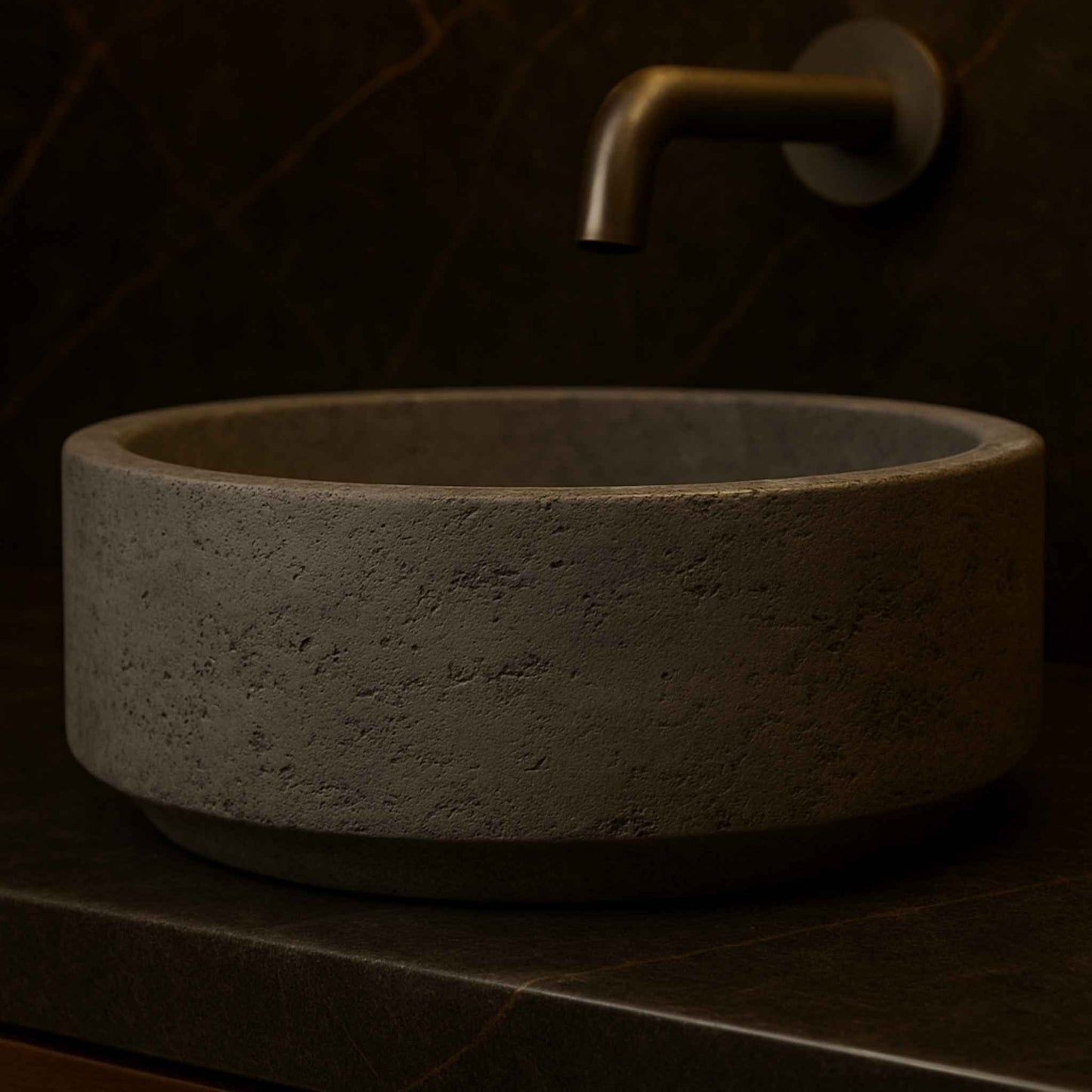 Full bathroom setup featuring a round textured concrete basin in luxury interiors