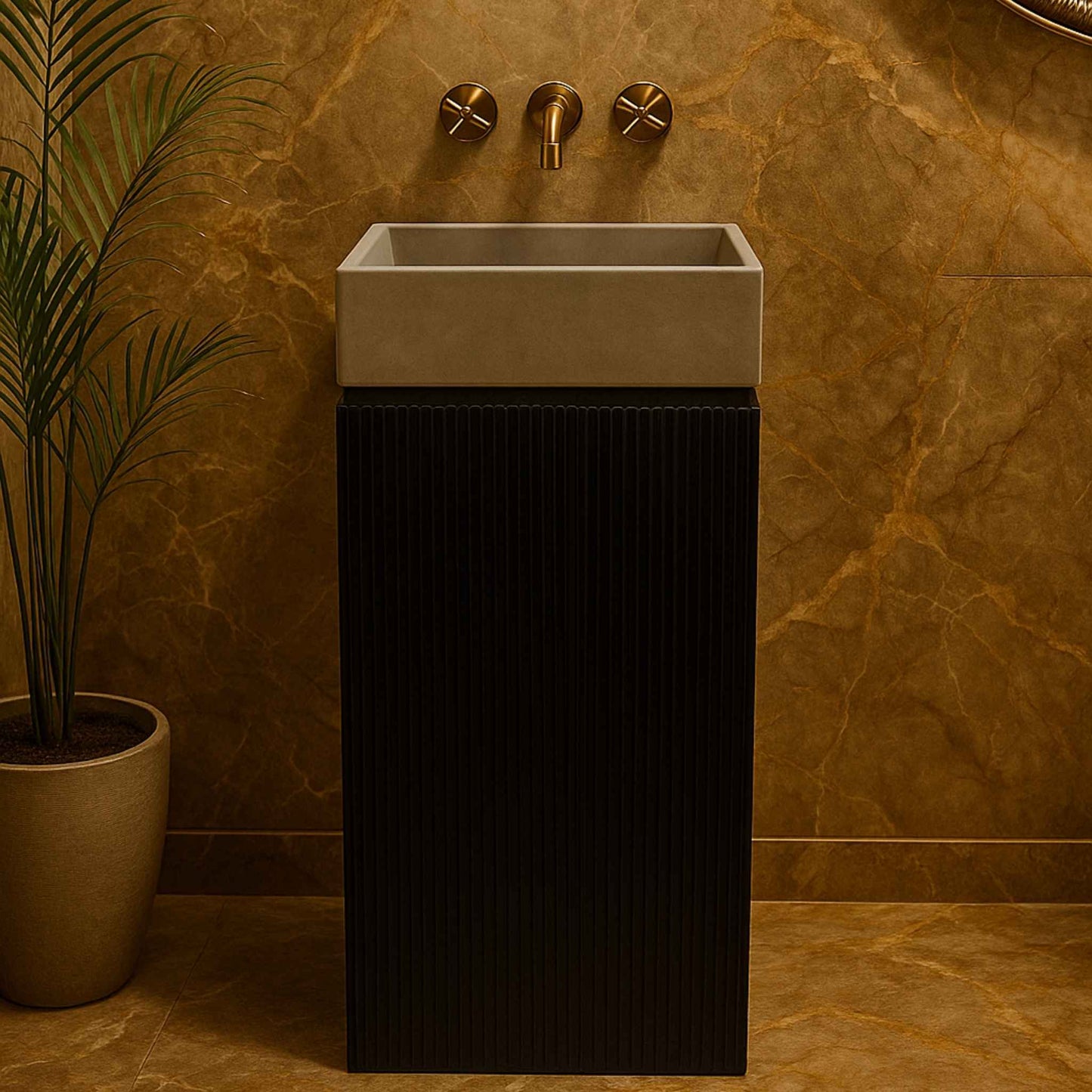 Front view of a luxury black fluted pedestal washbasin with grey concrete basin and wall-mounted brass faucet in a marble bathroom.