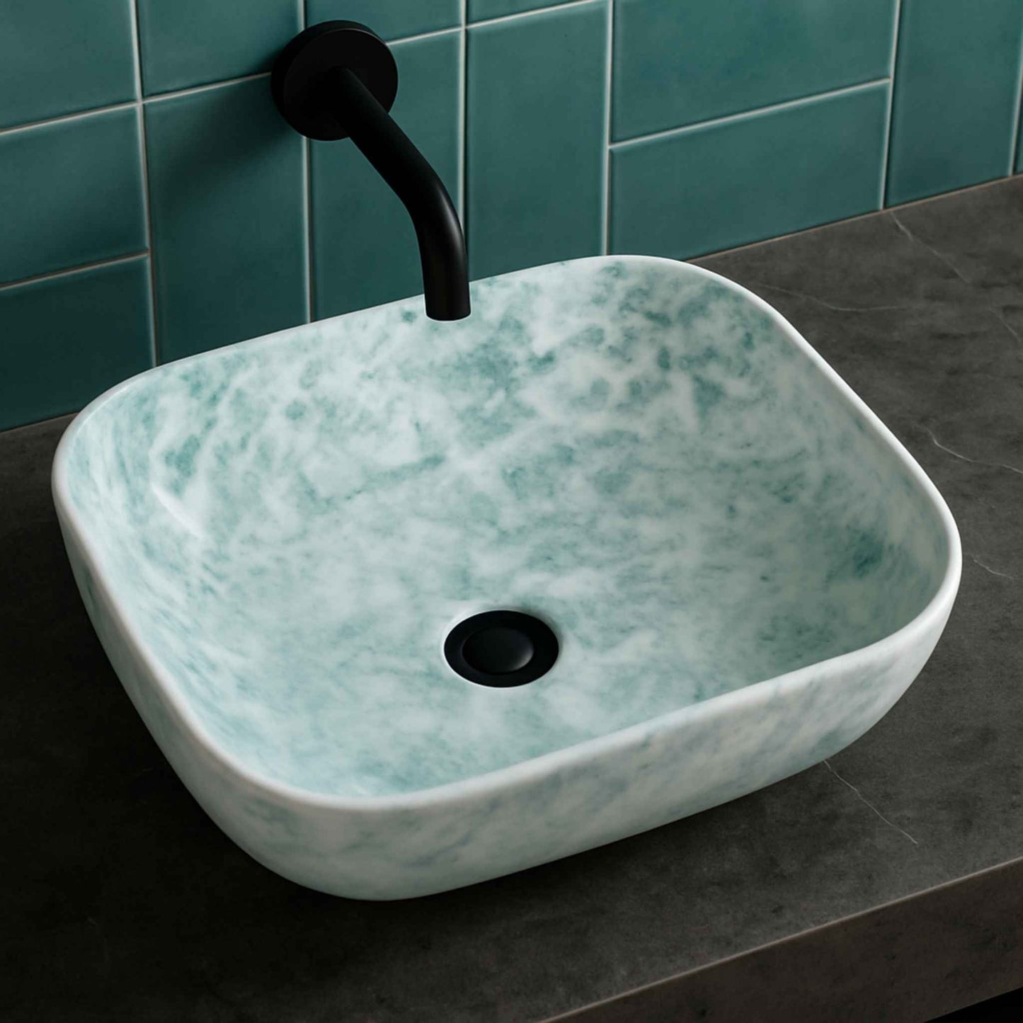 Top angle of designer stone-look bathroom wash basin with white and green pattern