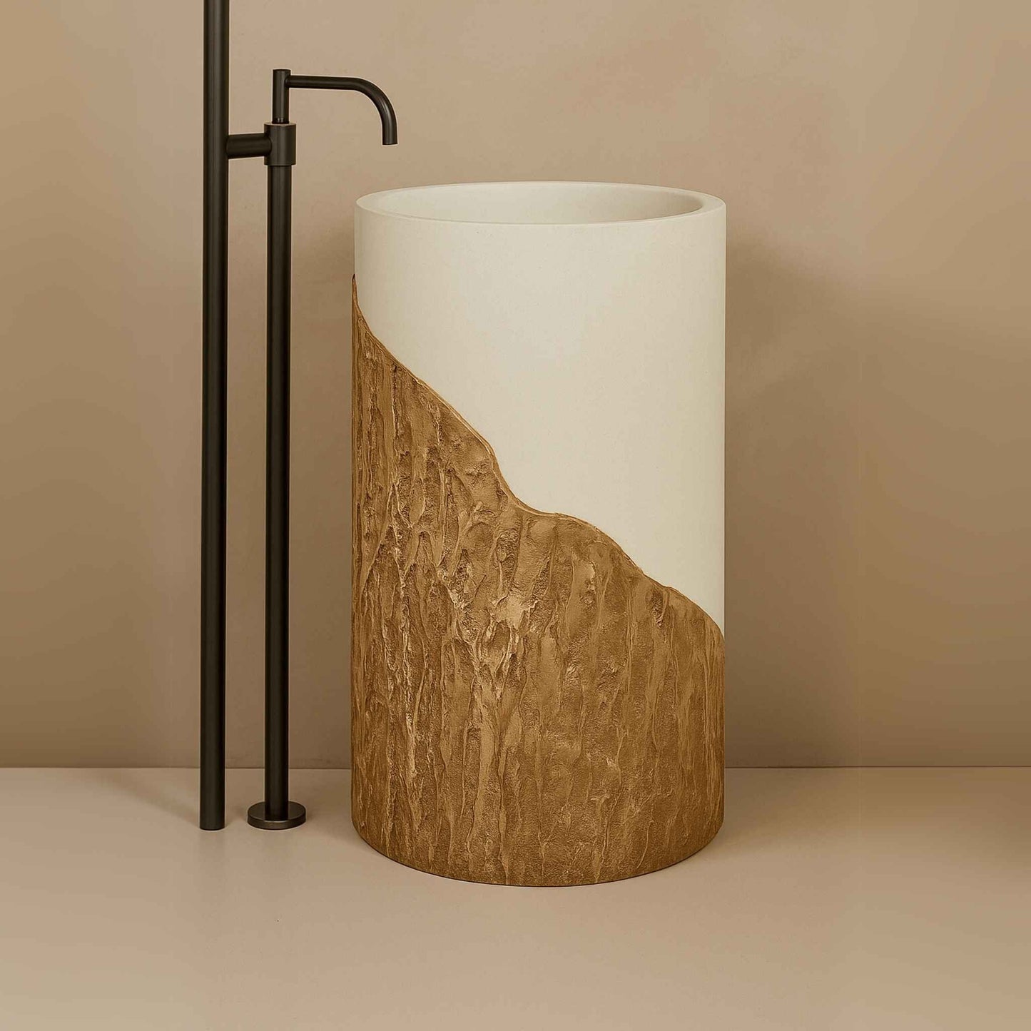 Front view of luxury beige and bronze pedestal washbasin with wall-mounted brass faucet.
