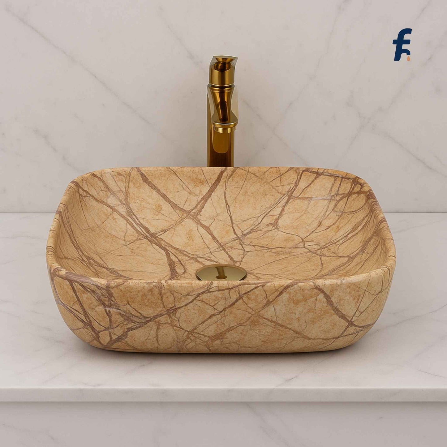 Marble-patterned sink with gold faucet on a white background