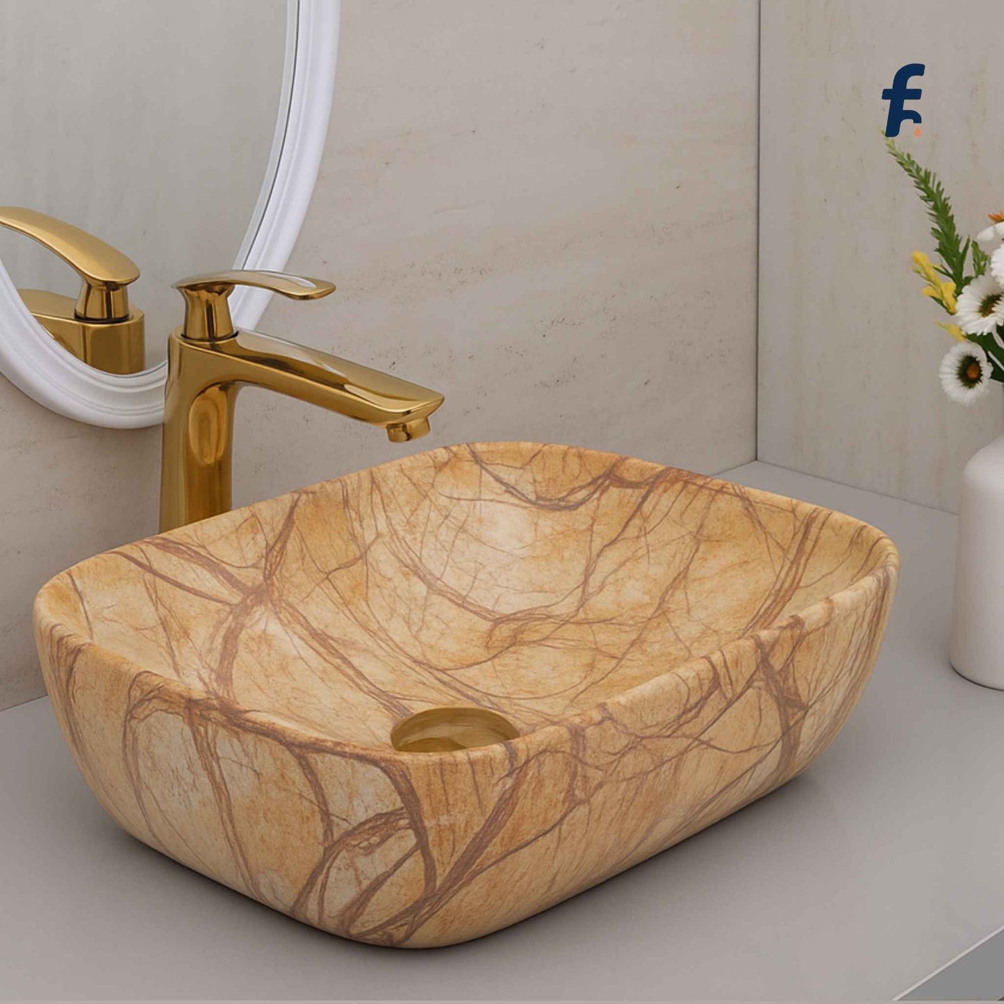 Marble-patterned sink with gold faucet in a bathroom setting