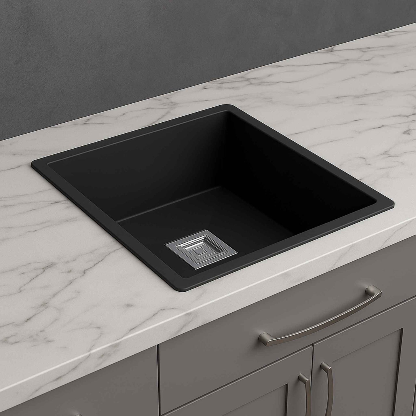 Side angle view of matte black granite kitchen sink with premium marble background