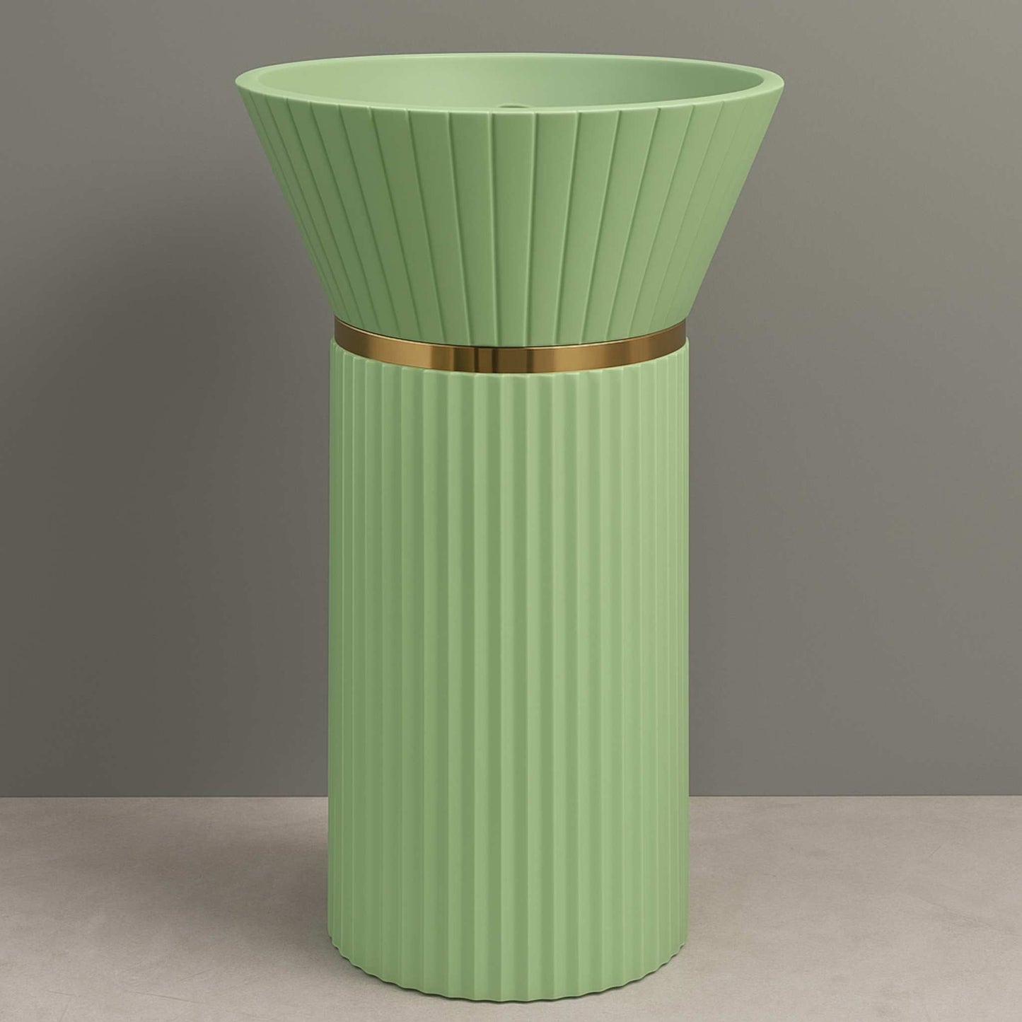 Front-facing view of mint green pedestal wash basin with fluted body