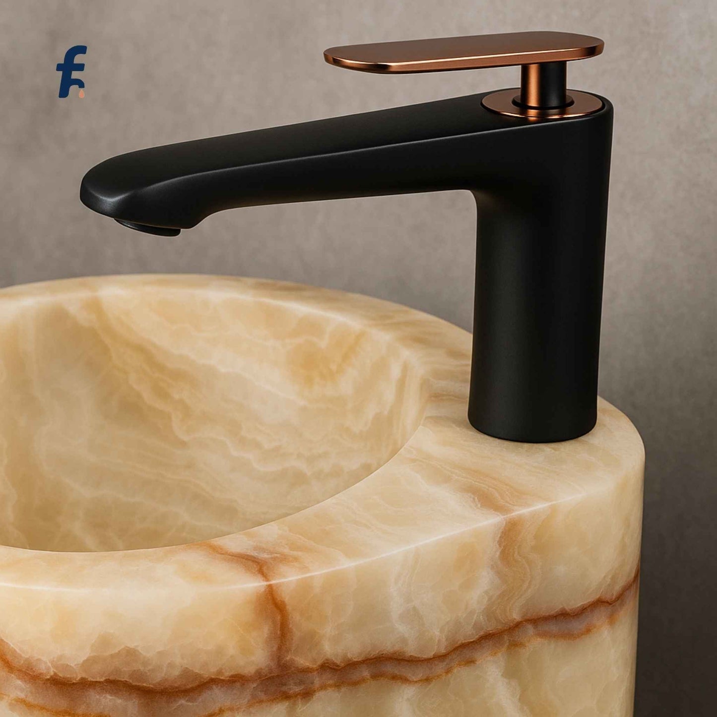 Black faucet with bronze accents on a marble sink