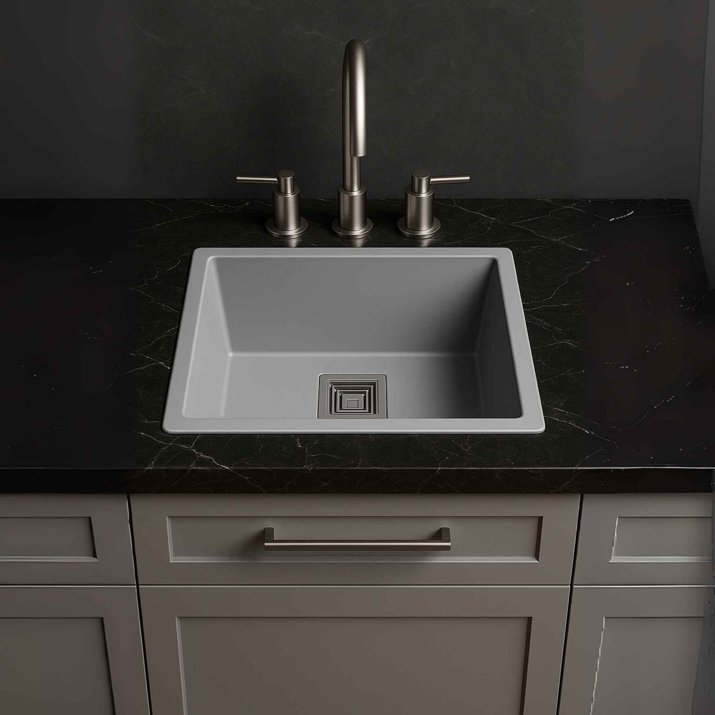 Full kitchen view showcasing grey metallic sink installed in dark Calacatta marble counter with luxury fittings