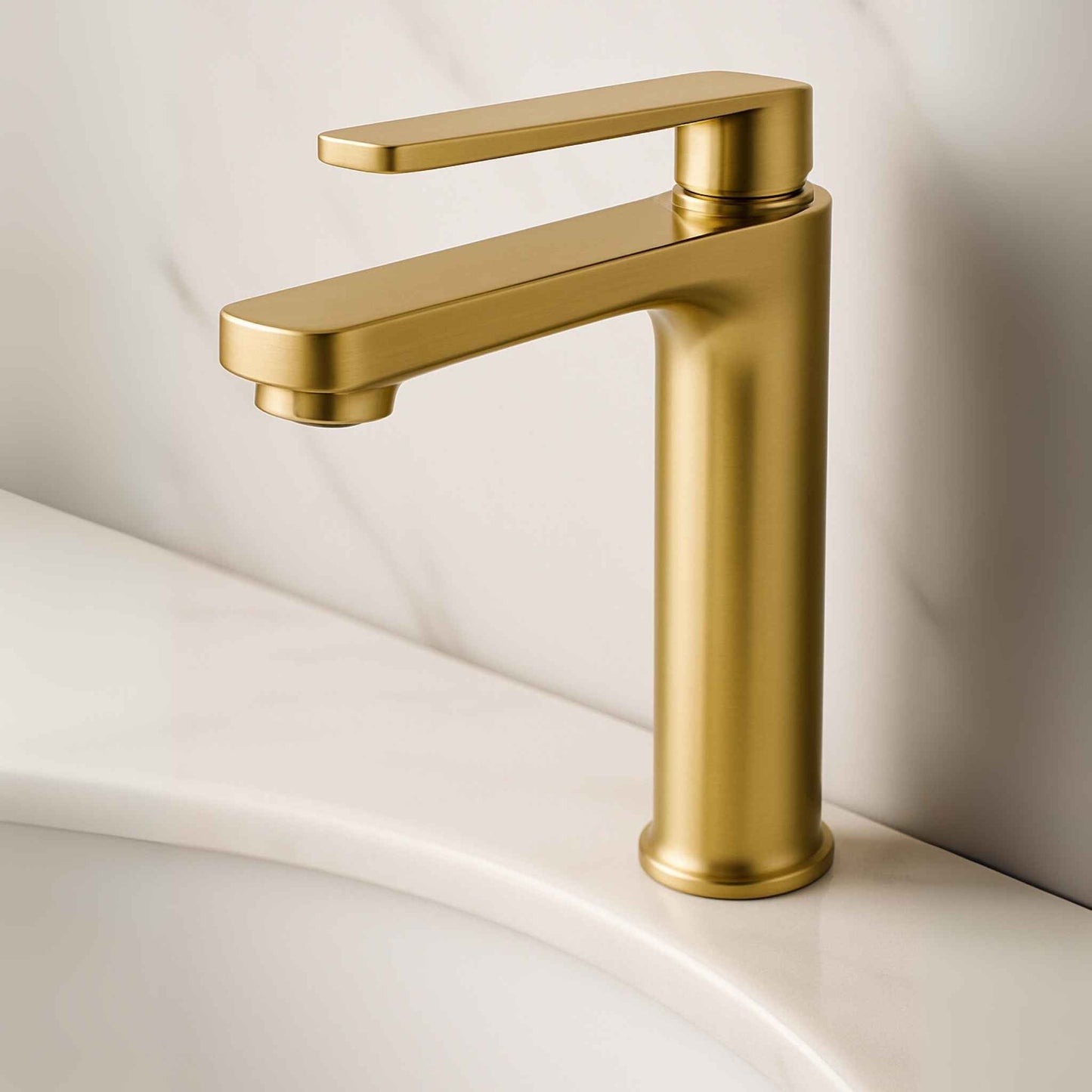 Gold faucet on a white sink with a neutral background, Designer bathroom with brushed gold tall basin mixer tap