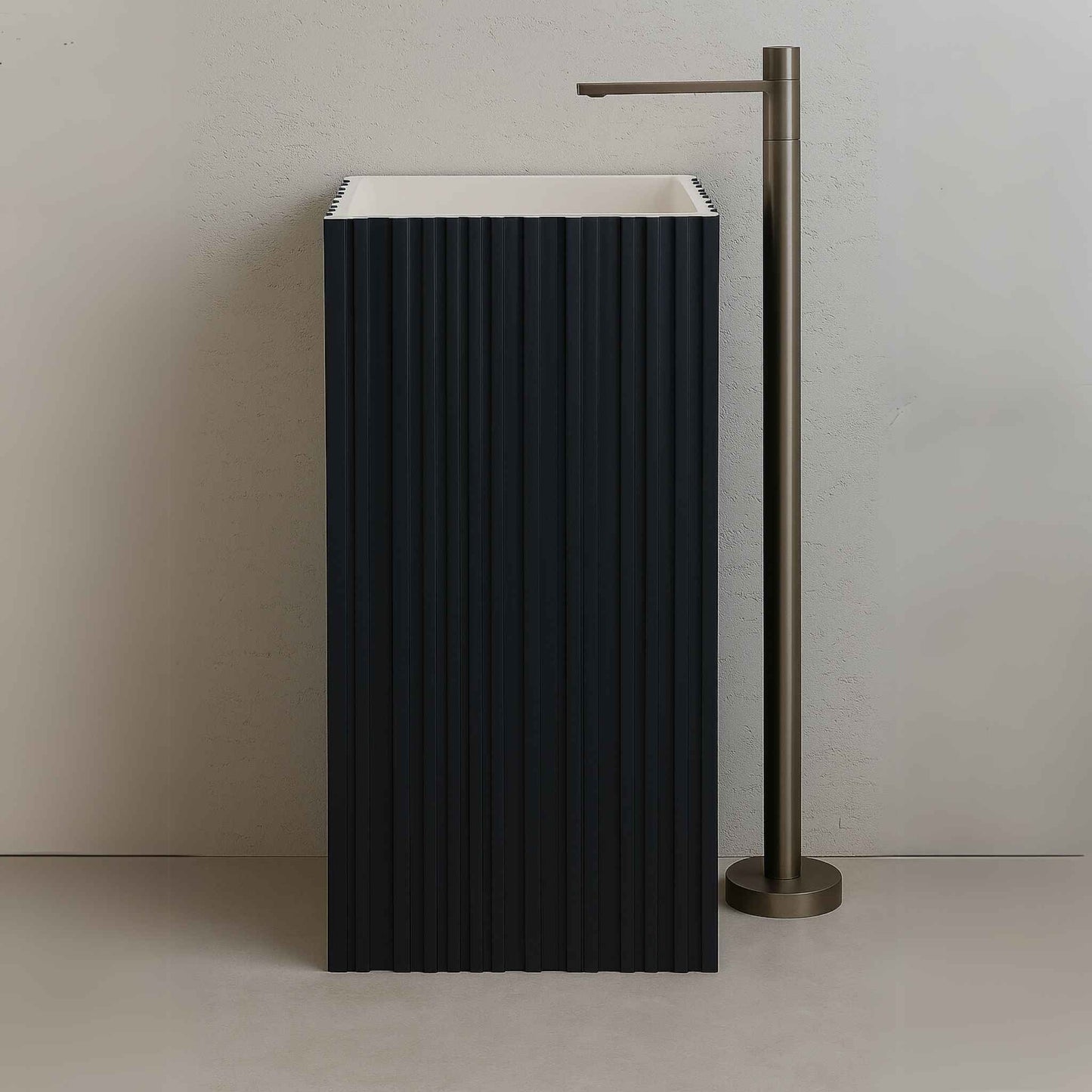 Front view of matte navy blue fluted pedestal sink with rectangular design