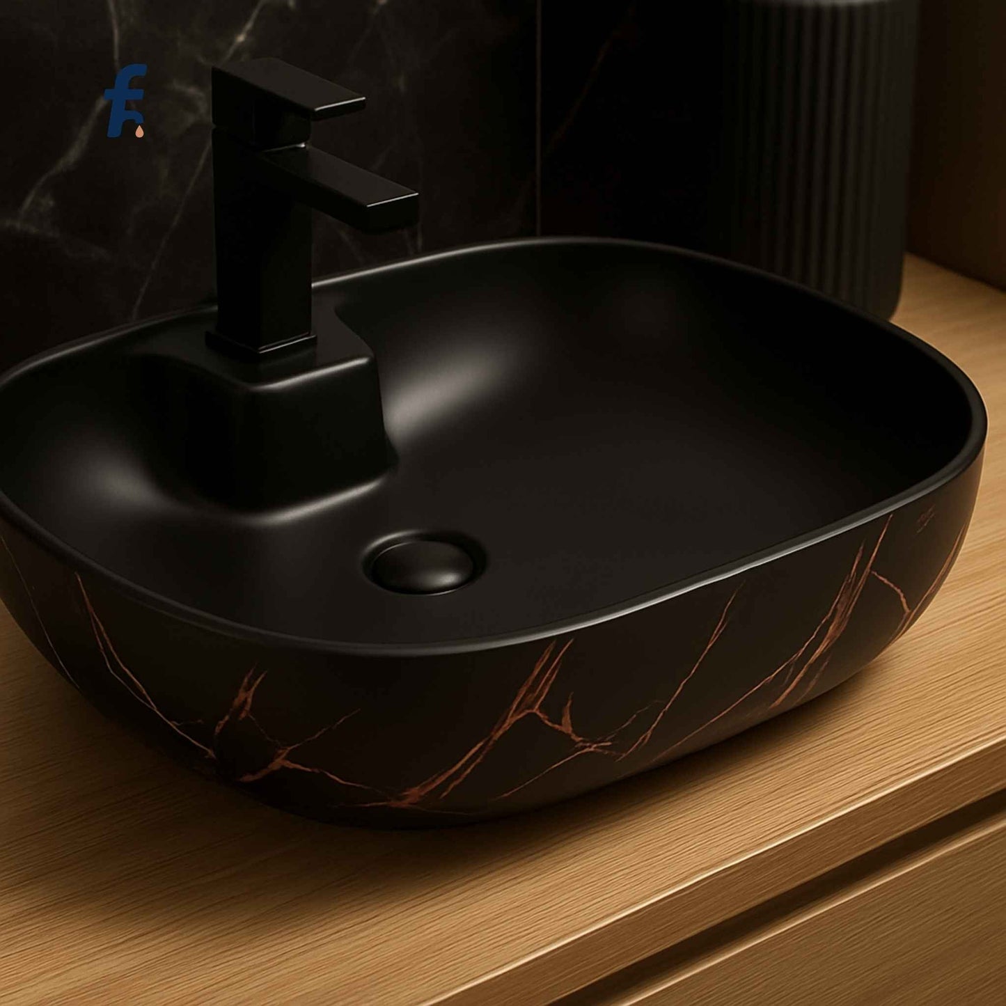 Black marble-patterned sink with a black faucet on a wooden surface.