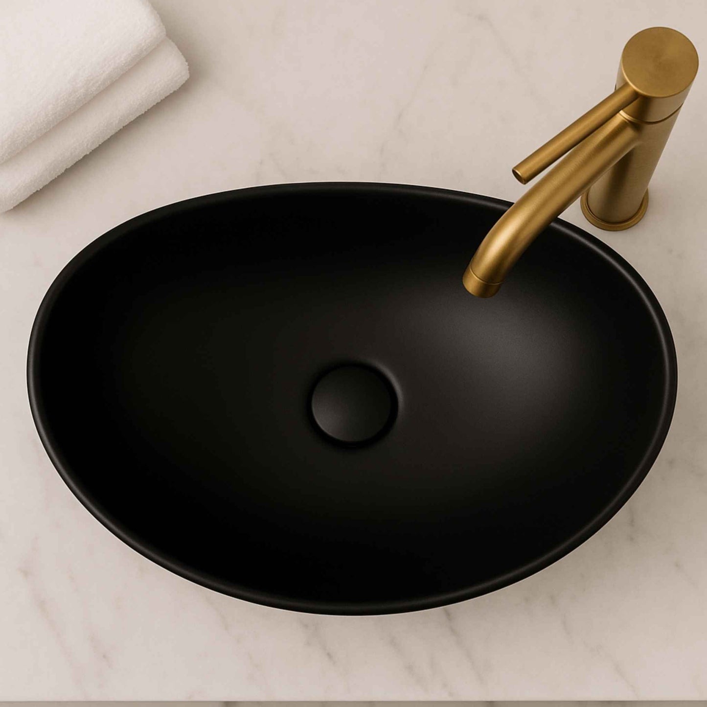 Top angle of matte black oval counter top basin with brushed gold faucet – 540mm modern bathroom sink