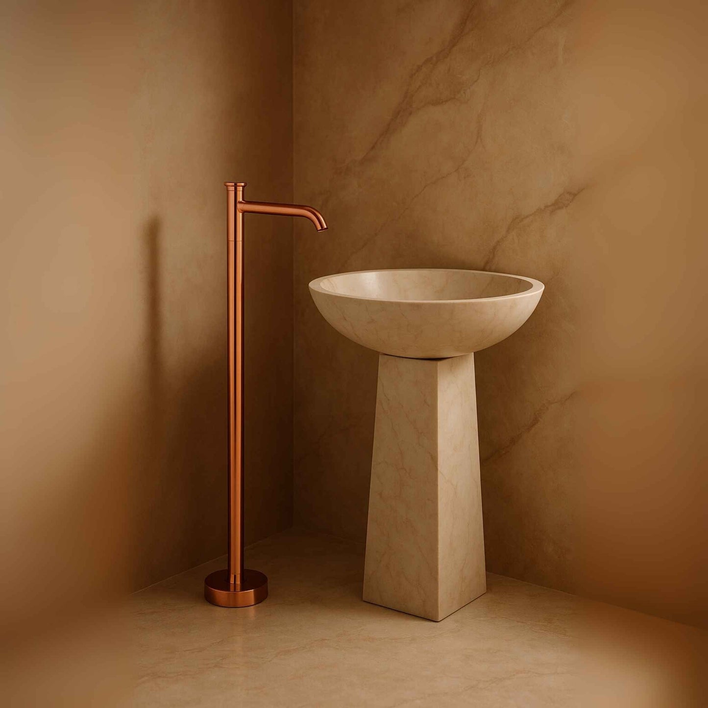 Rose gold floor mounted basin mixer beside luxury round pedestal in elegant bathroom