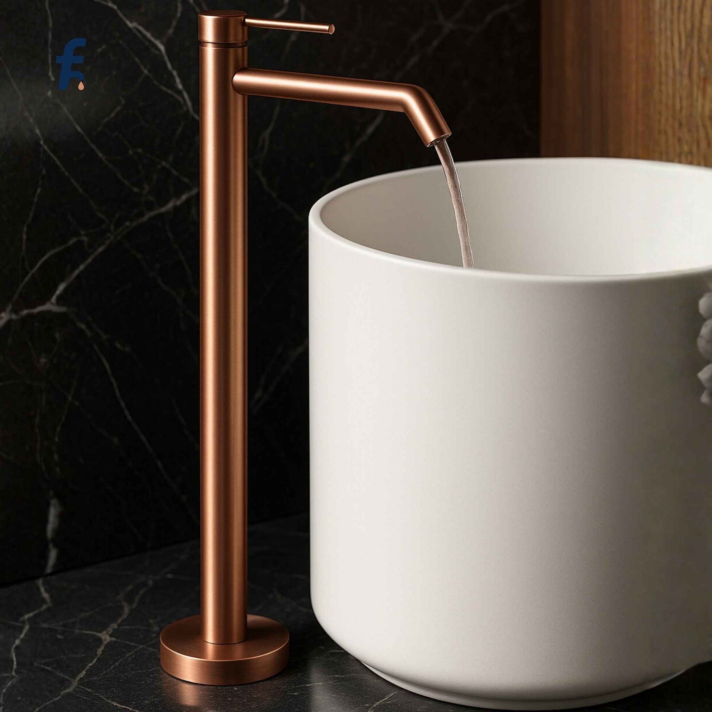 Side close-up of brushed rose gold tall freestanding faucet with pedestal basin
